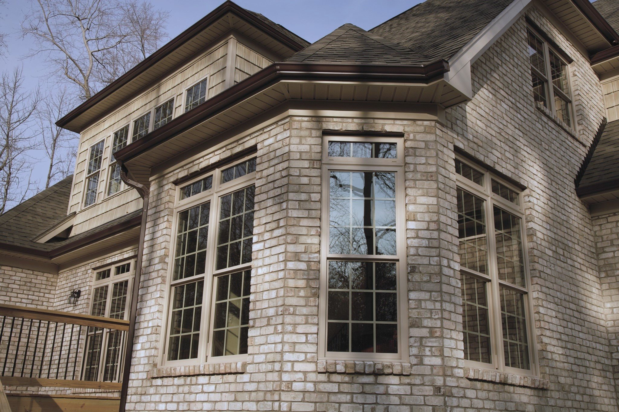 Woodlands Windows Colored Windows on brick house