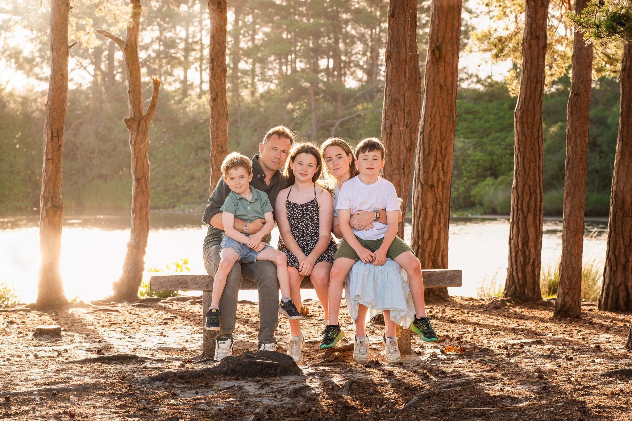 Family photography session at Frensham Ponds Surrey - lifestyle portrait at sunset by the lake