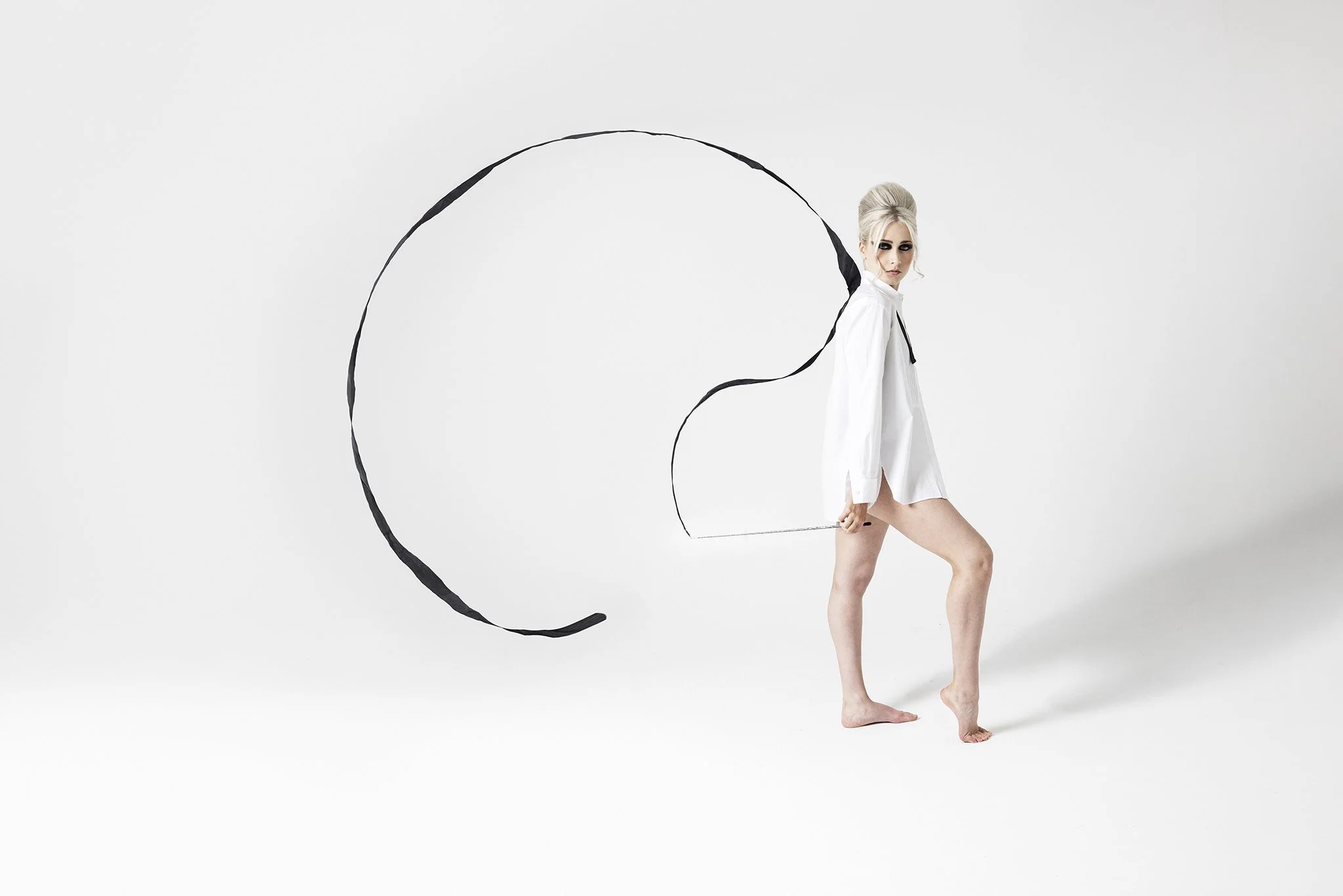 Woman spinning fabric in the air during Motion Dance Portrait Session with Beauclair Photography