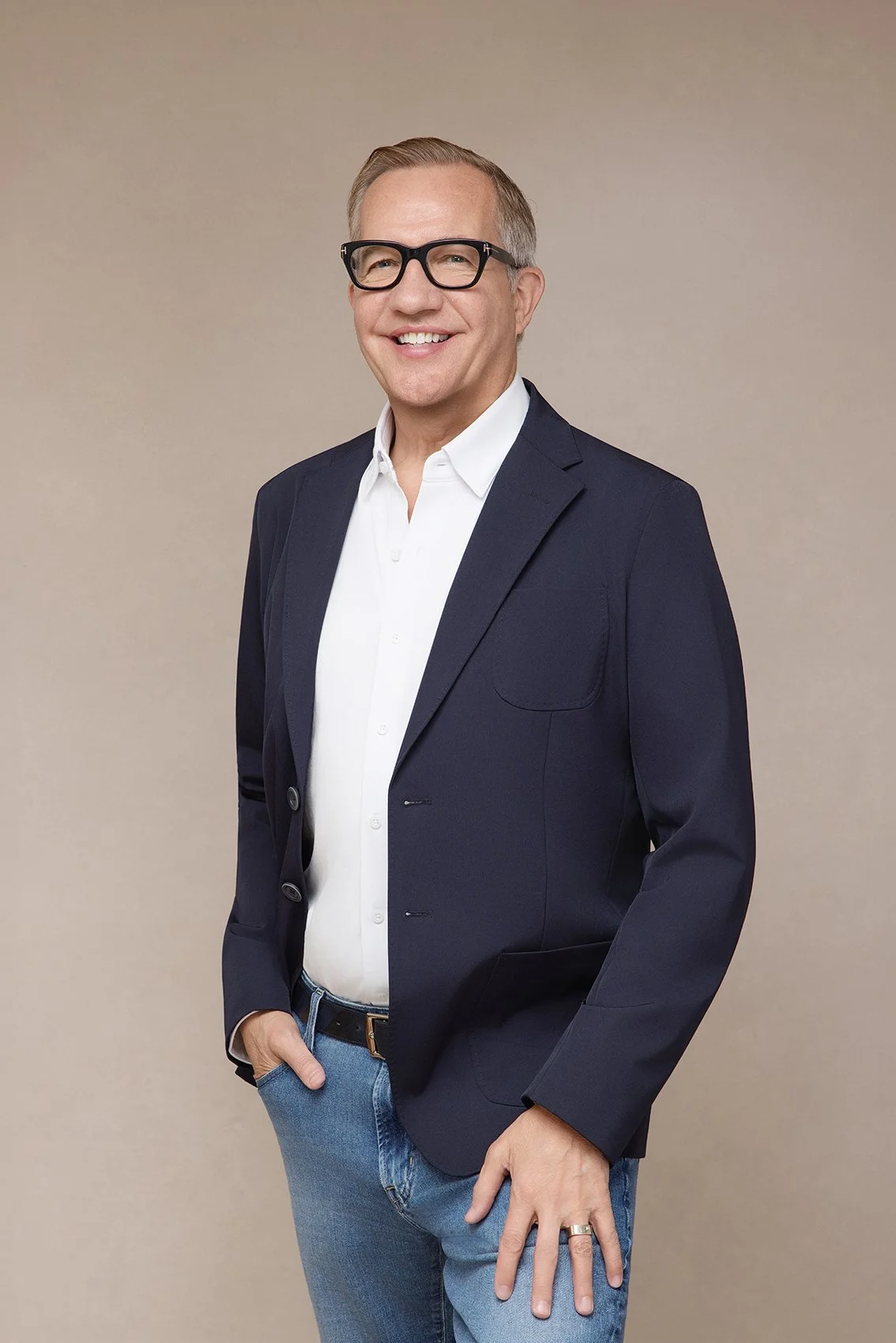 Professional headshot and branding portraits in Kirkland wa of man with dark suit jacket and glasses