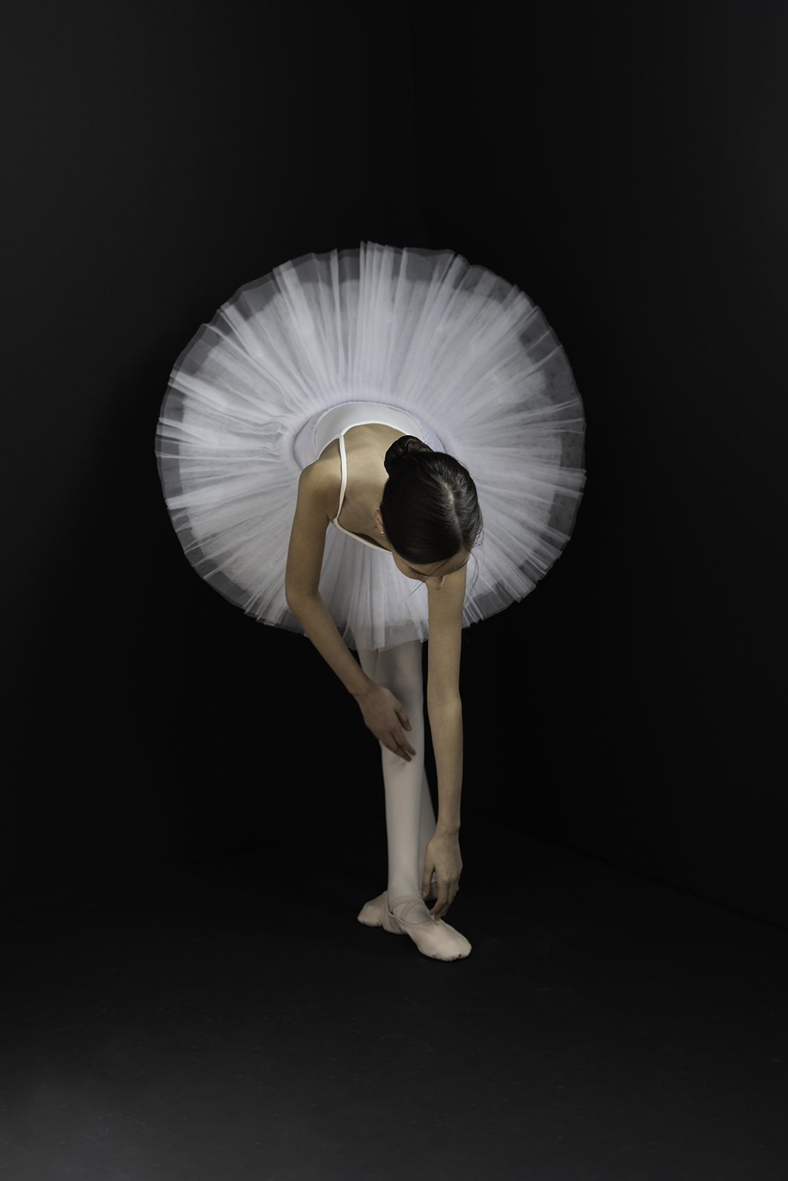  Child ballet dancer in white tutu and pink tights posing for a professional dance portrait by Beauclair Photography and Shannon Beauclair, award winning dance portrait. 