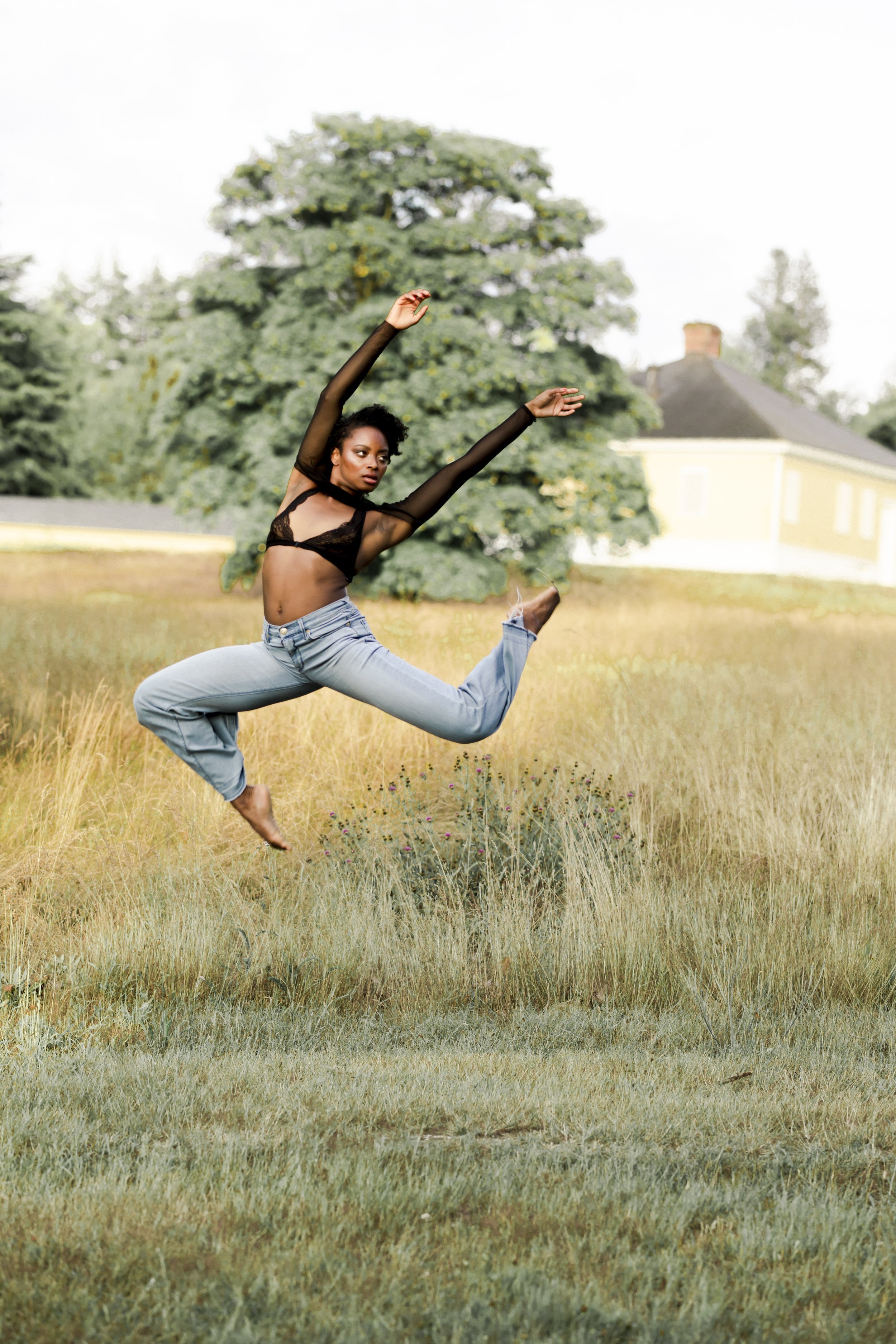 Woman jumping outdoors during Motion Dance Portrait Session with Beauclair Photography
