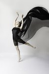 Woman on one foot with arm in air during Dance Portrait Session with Beauclair Photography