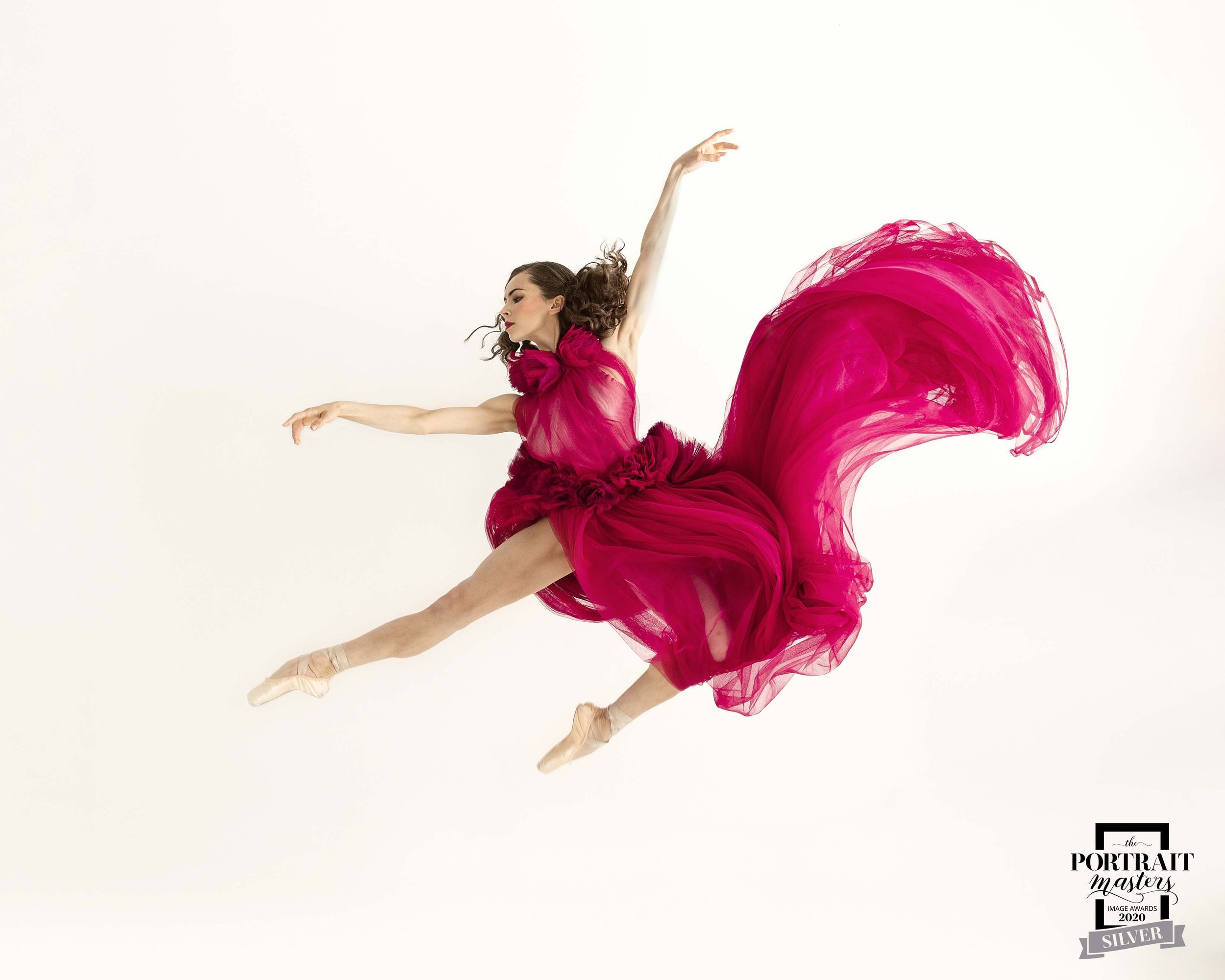 Woman jumping with fabric flowing during Motion Dance Portrait Session with Beauclair Photography