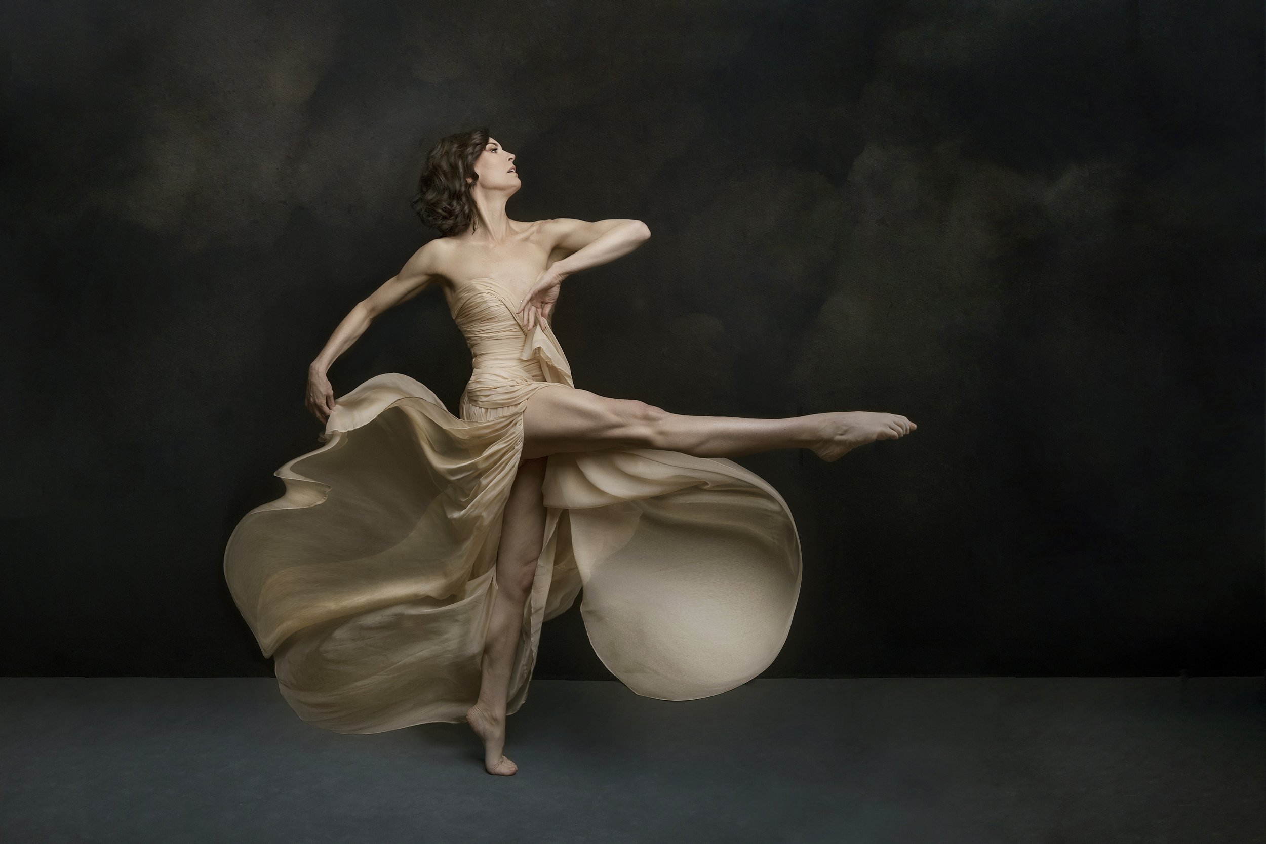 Woman with leg in air and fabric flowing during Motion Dance Portrait Session with Beauclair Photography