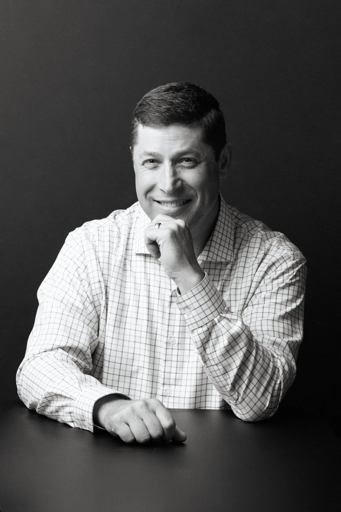 Issaquah professional executive and corporate headshots of man in white shirt in black and white photo by Beauclair Photography