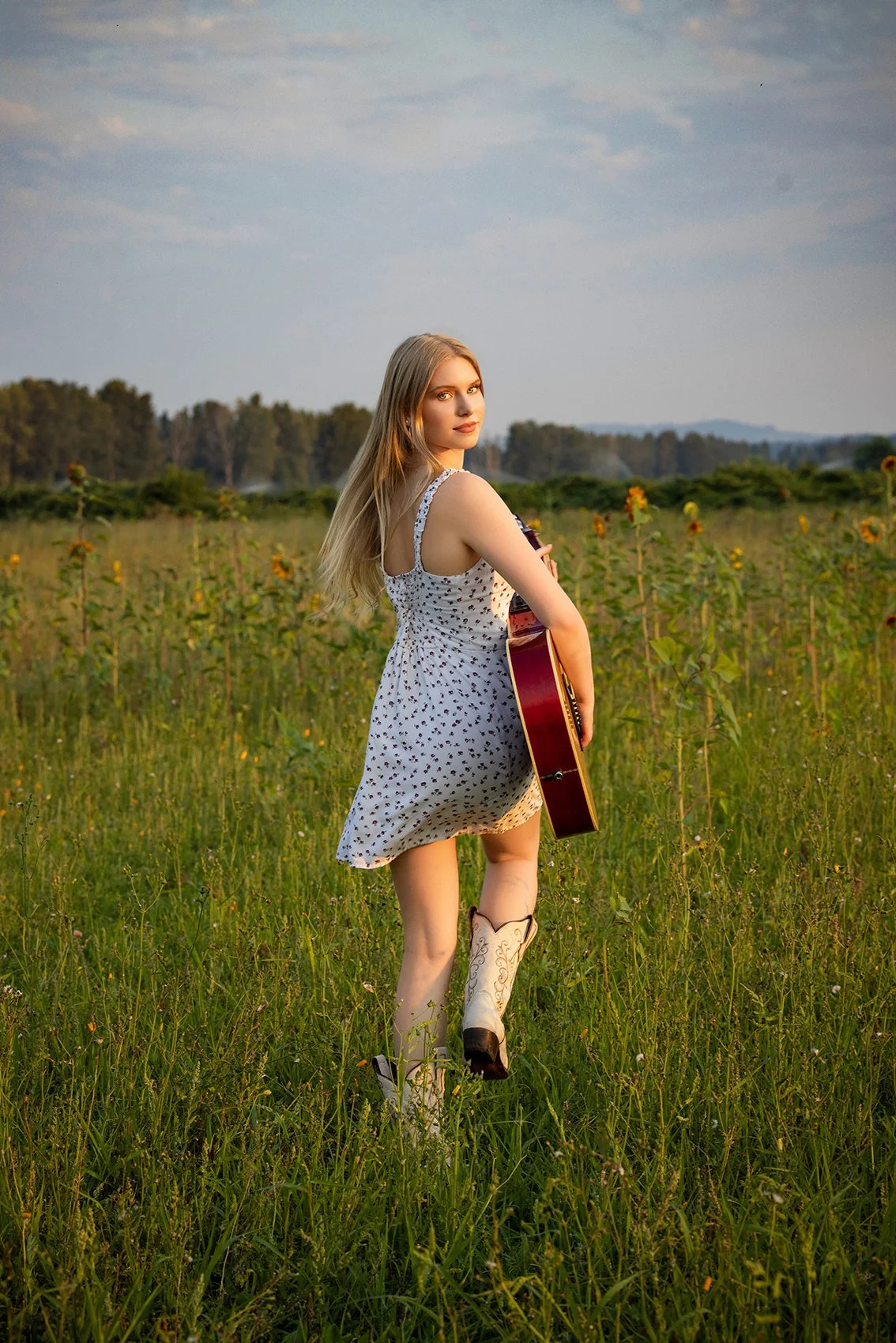 Bellevue High School Senior portraits by Beauclair Photography in a flower field