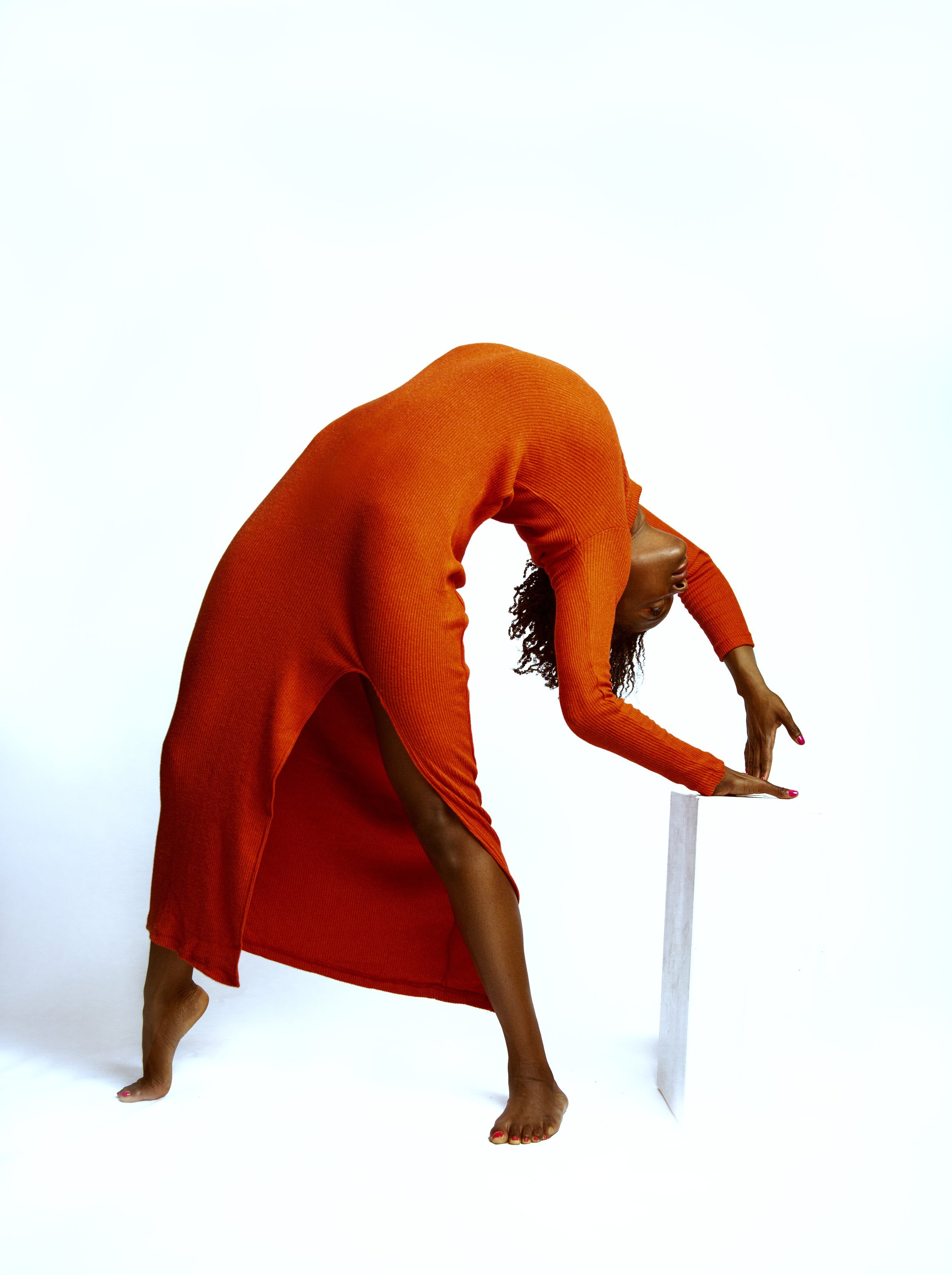 Woman bending backwards onto a posing block during Motion Dance Portrait Session with Beauclair Photography