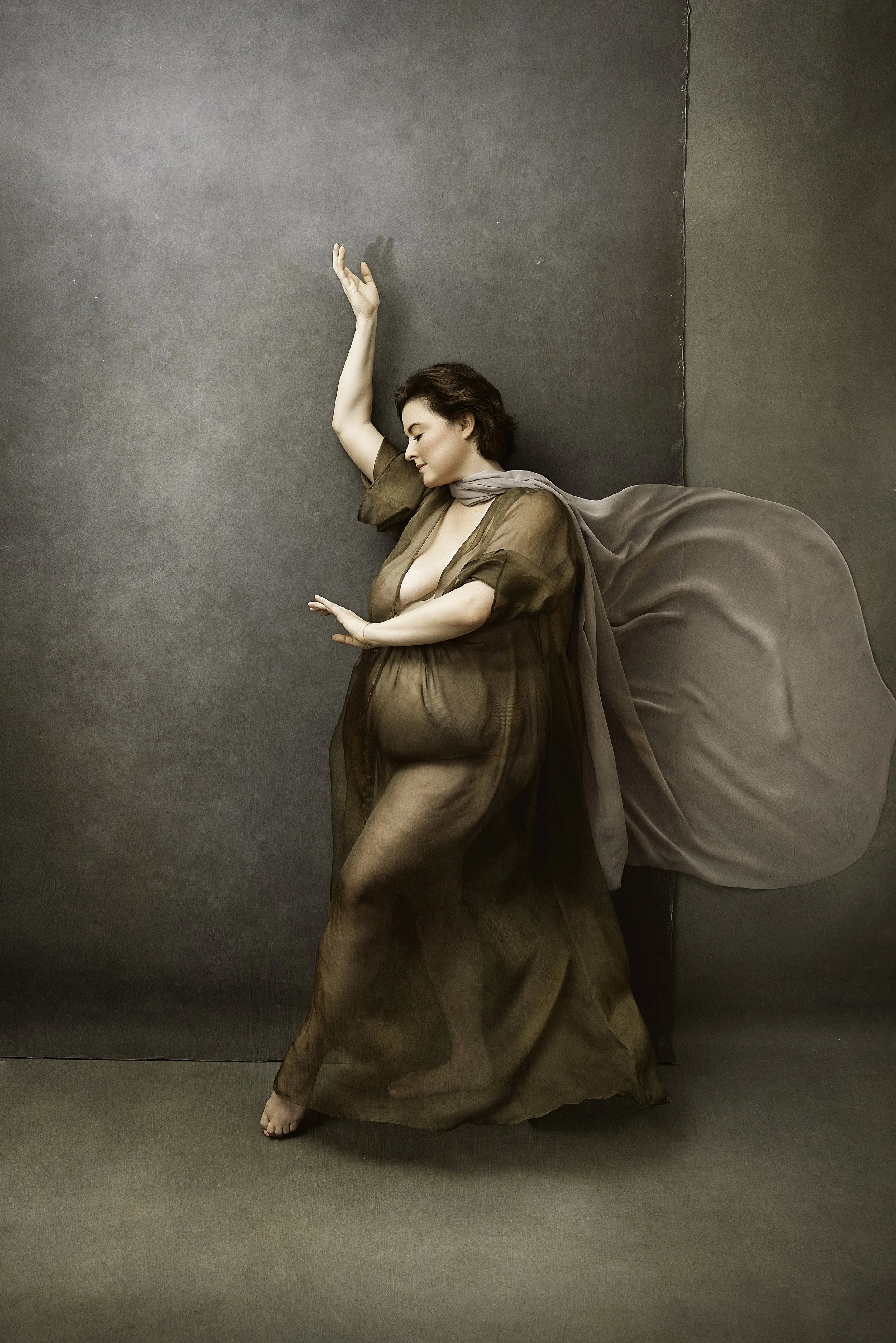 Woman dancing with arms in air during Motion Dance Portrait Session with Beauclair Photography