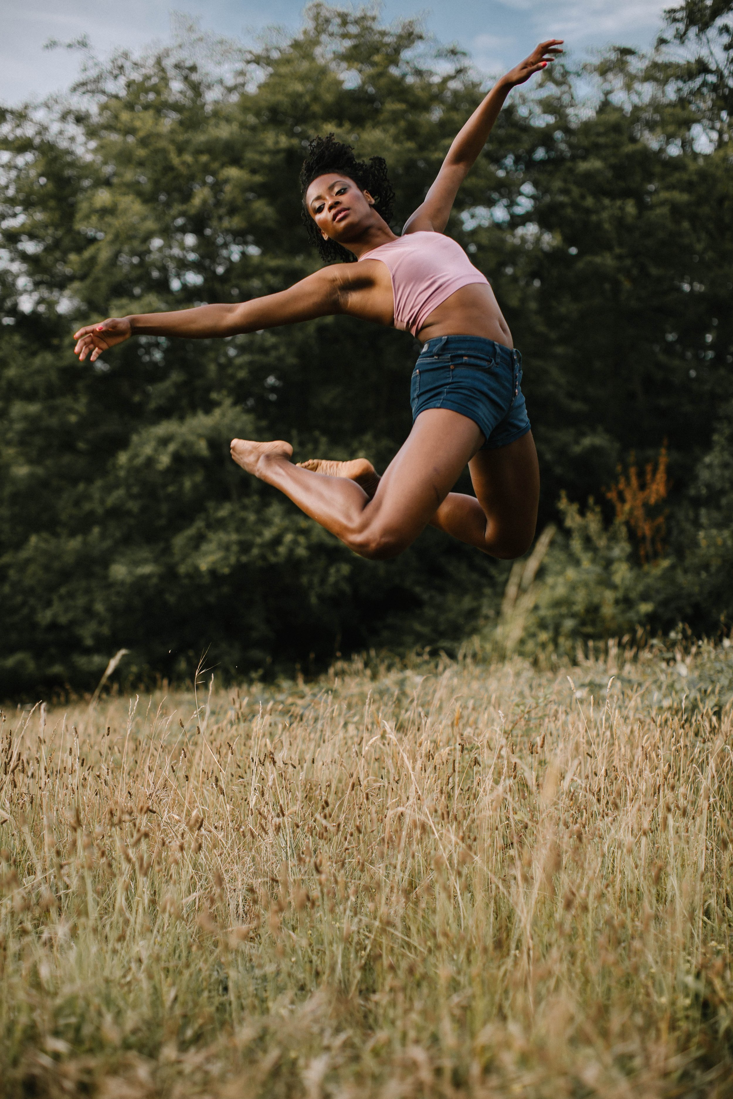 Woman jumping in air during Motion Dance Portrait Session with Beauclair Photography