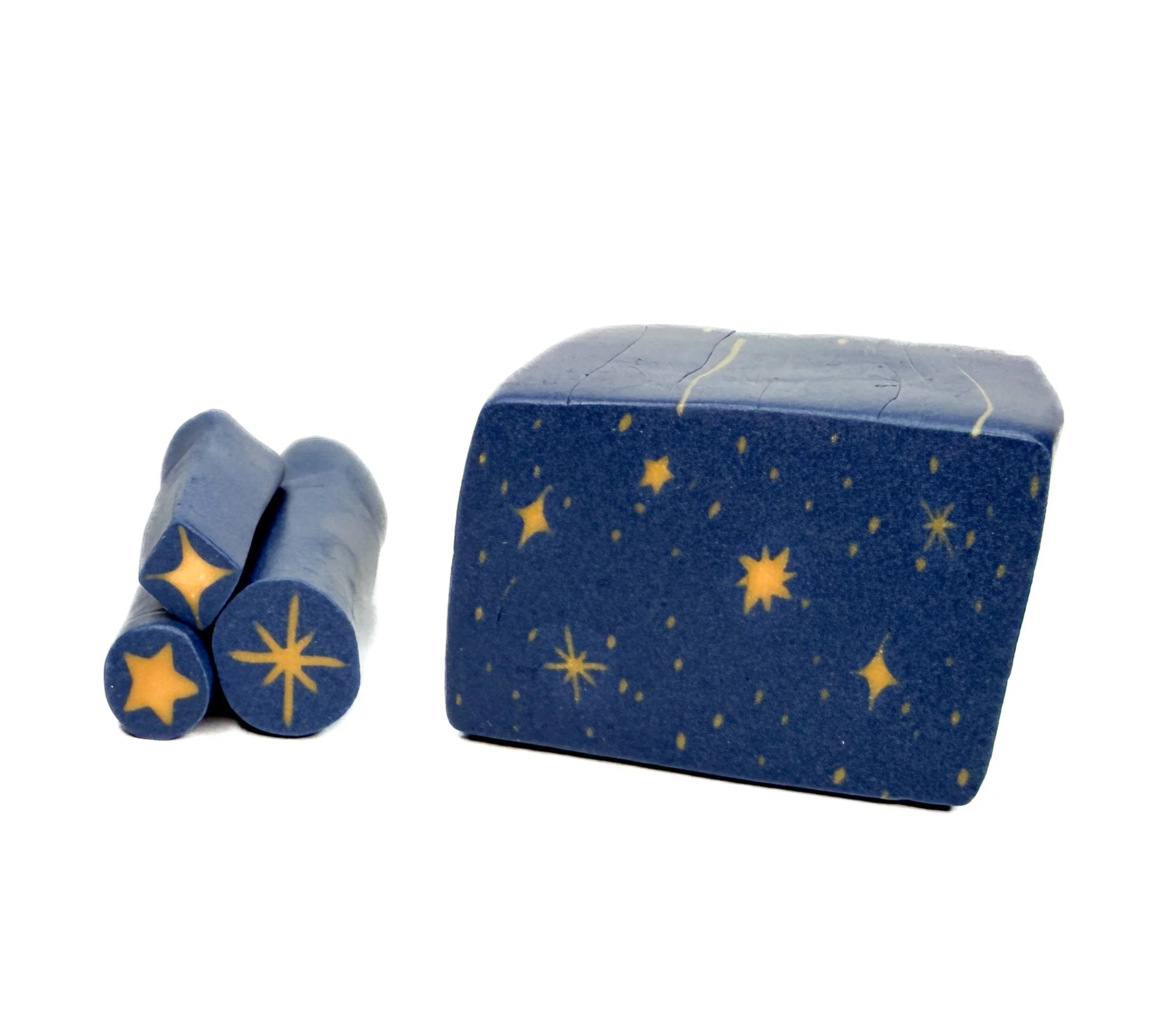 A blue lunar-themed rubber stamp and three corresponding stamping cubes with star and moon designs on a white background.