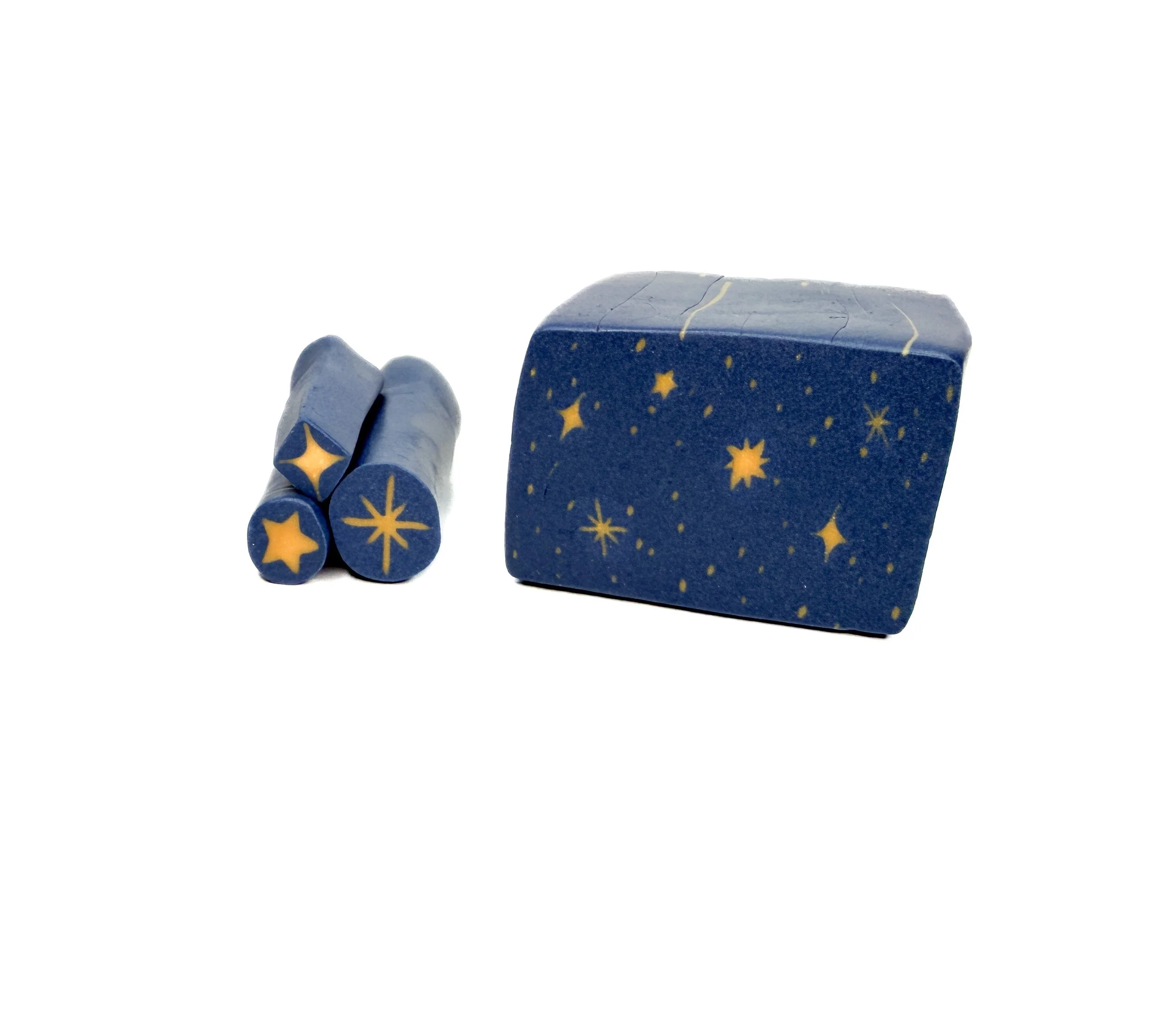 Blue star-themed chalk set with two crayons and a block.