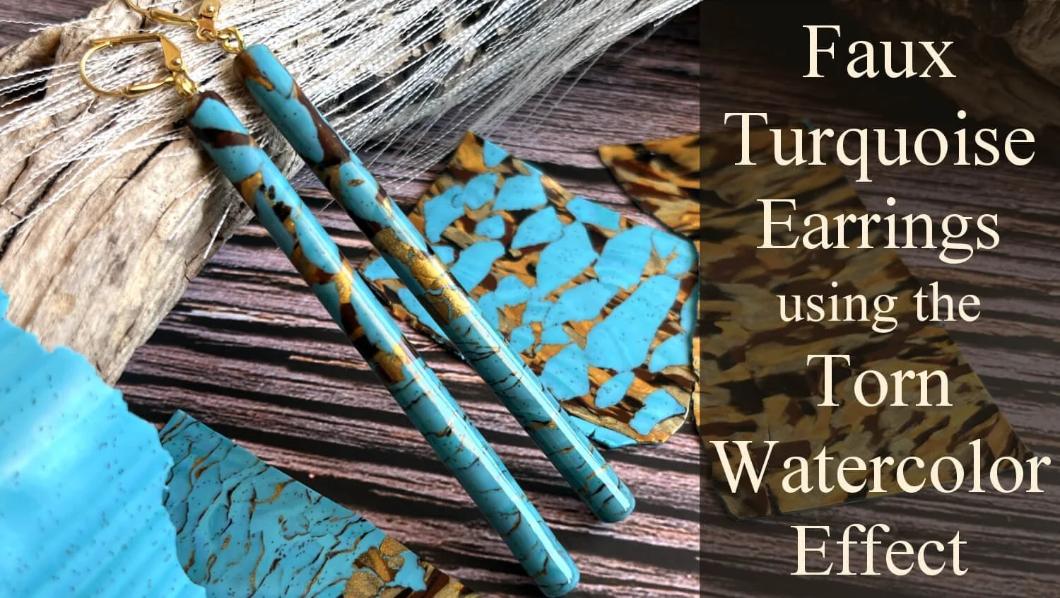 Turquoise earrings and jewelry making materials with torn watercolor paper and textured wooden background, demonstrating a faux turquoise watercolor effect.