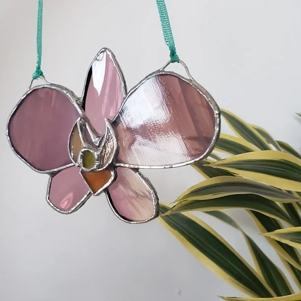 Ok one more pic! This one was a fun experiment with layering glass and soldering the layers together to create a somewhat 3D effect. I will definitely try that again, perhaps on a larger scale though! π€