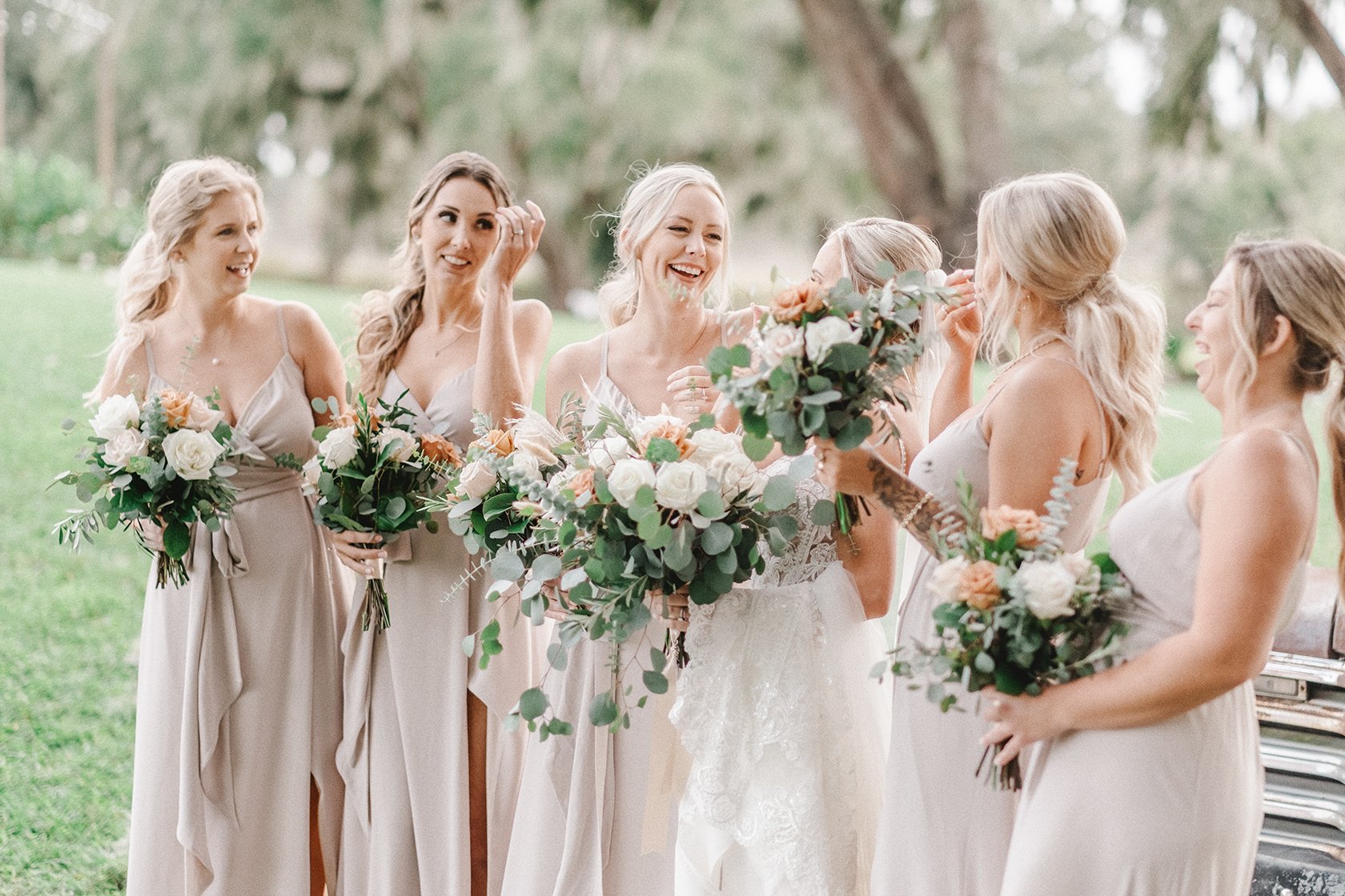 Bride sharing a joyful moment with her bridesmaids before her Boca Grande wedding.