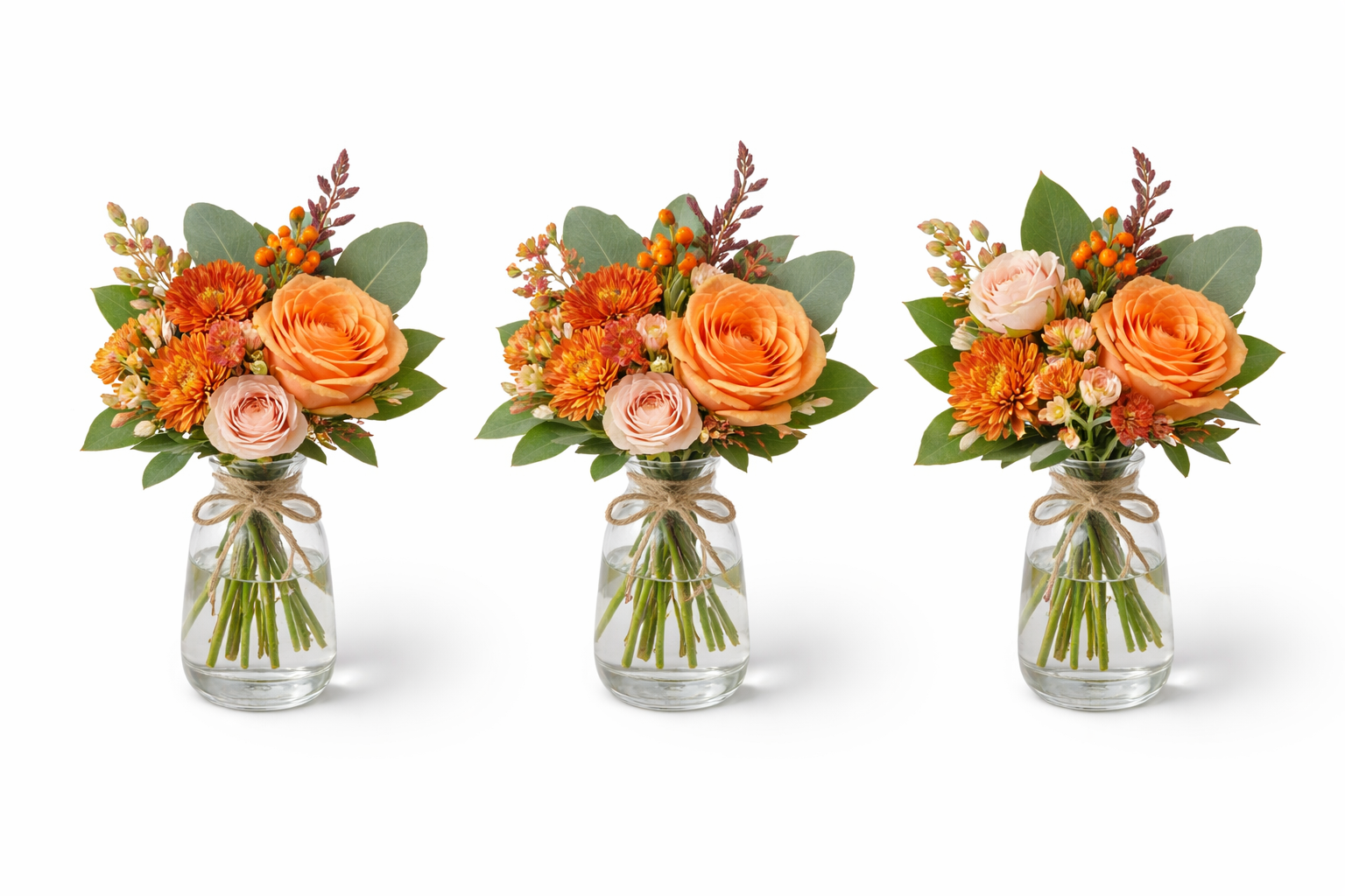 Elegant floral trio in glass vases.png