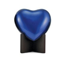 Blue heart-shaped object on a black stand