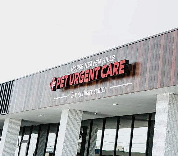 Front view of Horse Heaven Hills Pet Urgent Care & Veterinary Center sign on a building facade.