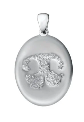 Oval silver pendant with textured abstract design and a small loop for a chain.
