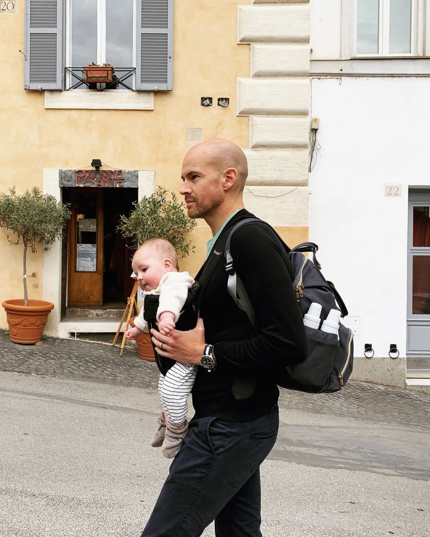 Whenever I think of how tough a trip with a kid might be, I remember one of my favorite shots of my husband and our 6 month old in Italy. It's almost always worth it. Take the trip.