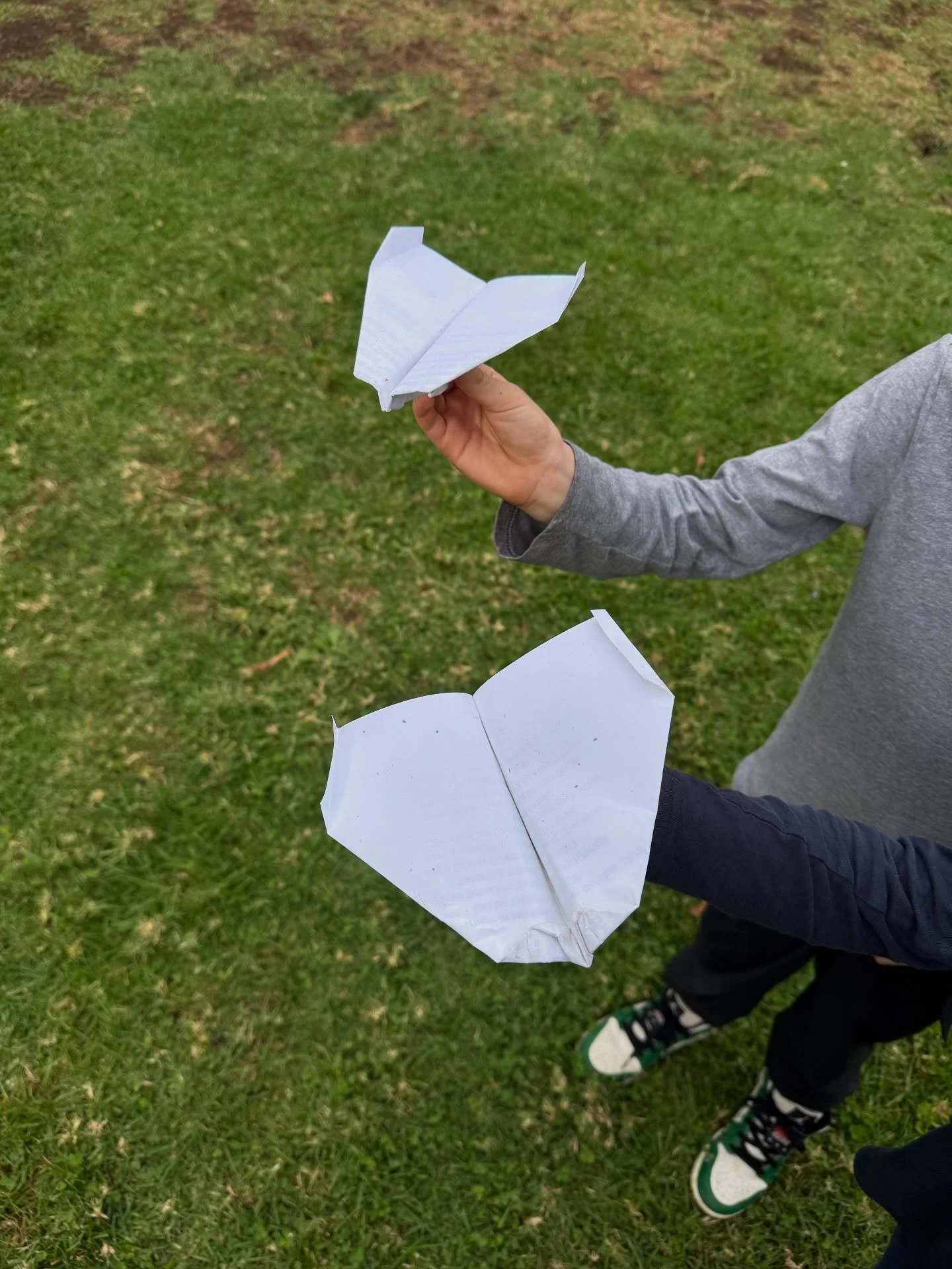 Paper planes never fail to delight! Came across these two at school pickup.