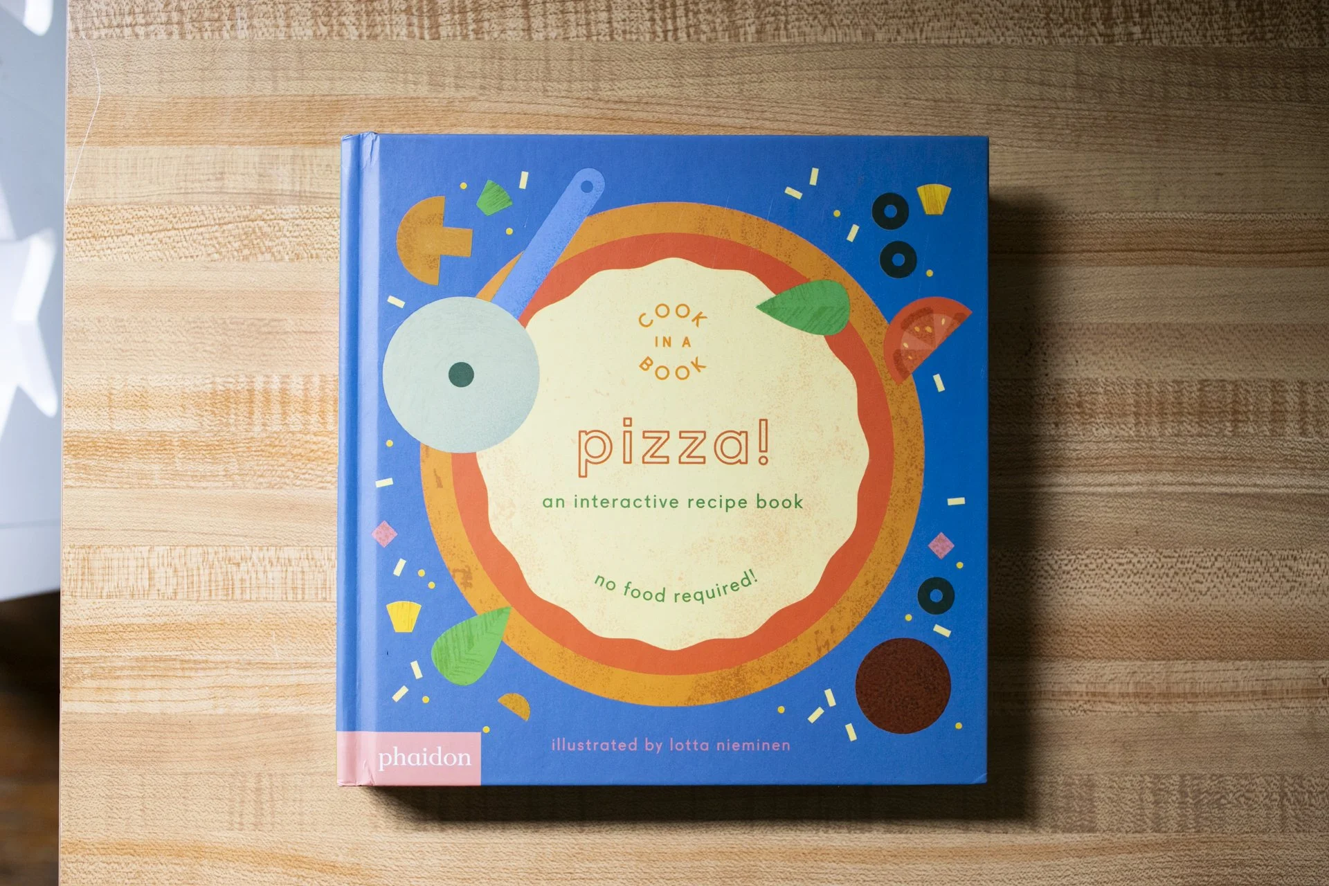 PIZZA! is one in the super fun Cook in a Book series that include real recipes of foods that kids tend to love. The interactive features like pulls, spinners, and punch-outs are brought to an imaginative new level by making it look like you're siftin