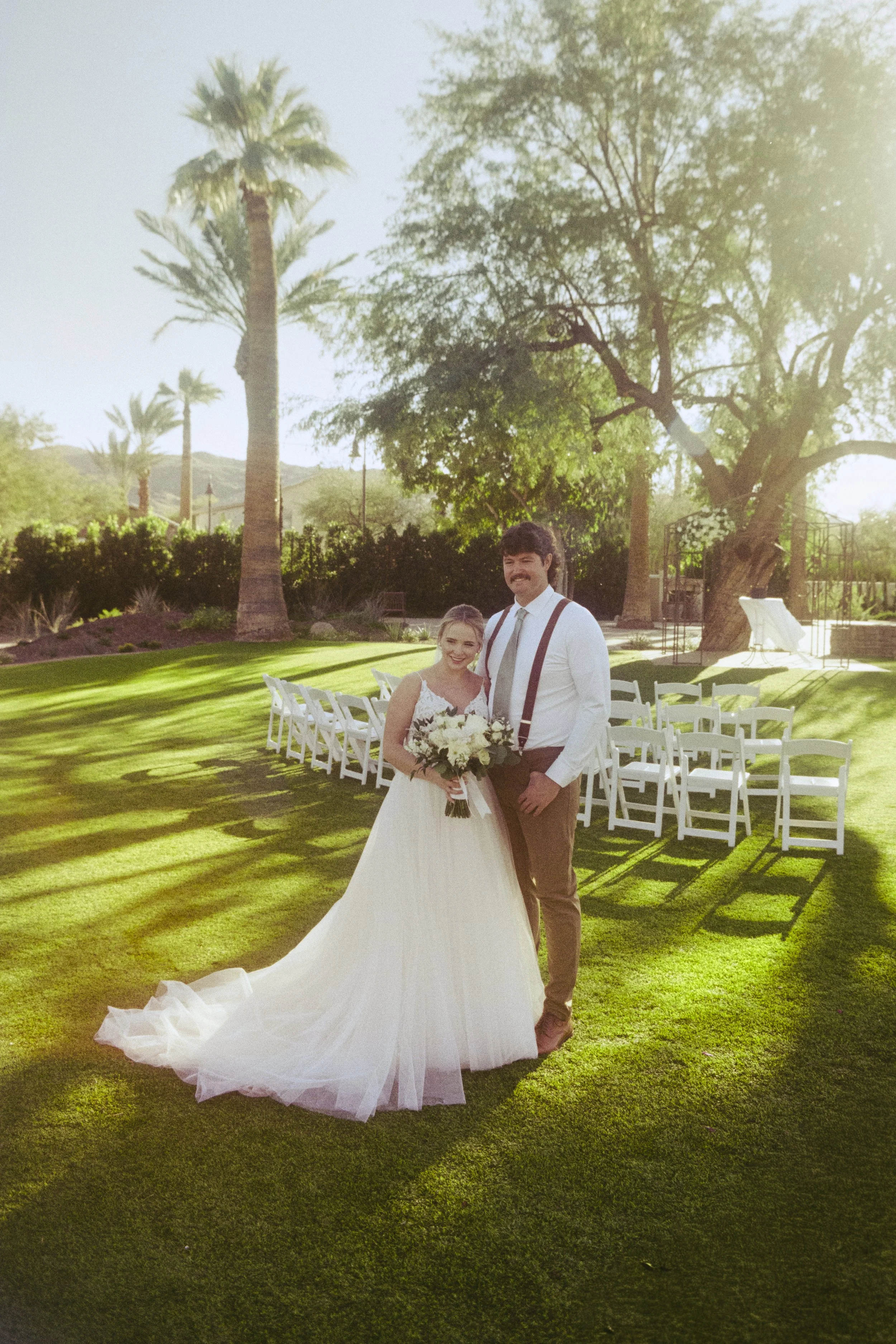 Young female athlete holding a flaming spear in a black sports outfit with 'BHSU' on her shirt, standing against a black background.