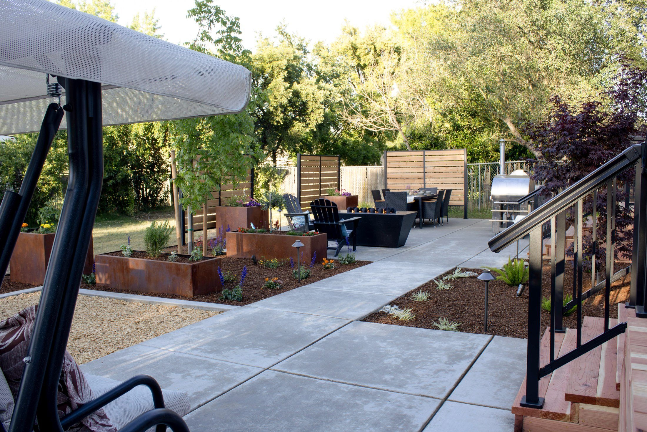 The shaded lounge and linear fire table, made for evenings outside.