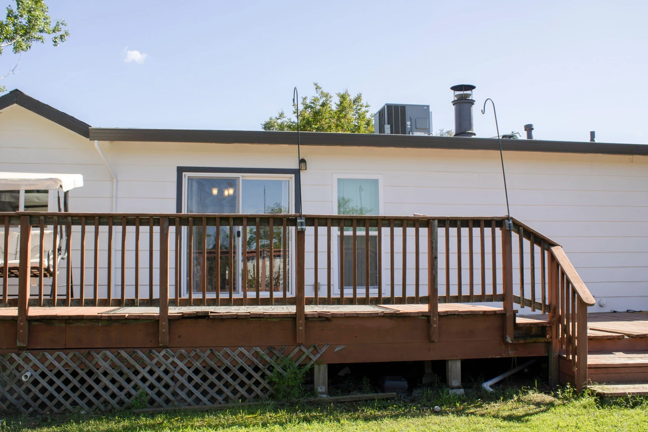 Before: the tired backyard and worn deck that Palmatum reimagined.