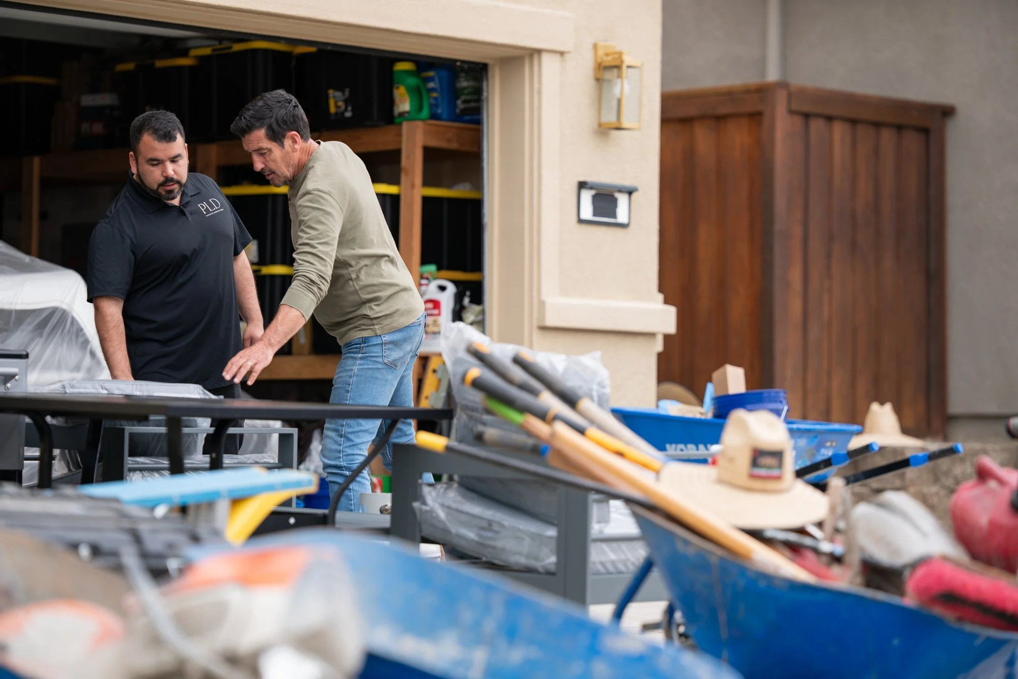 Landscape designer Matthew Vasquez of Palmatum Landscape Design working alongside host Jonathan Knight during HGTV's Crashers renovation in Roseville, CA