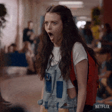 GIF of brand designer reacting with a shocked expression after hearing the steakhouse owner is 50, emphasizing the emotional connection in branding.