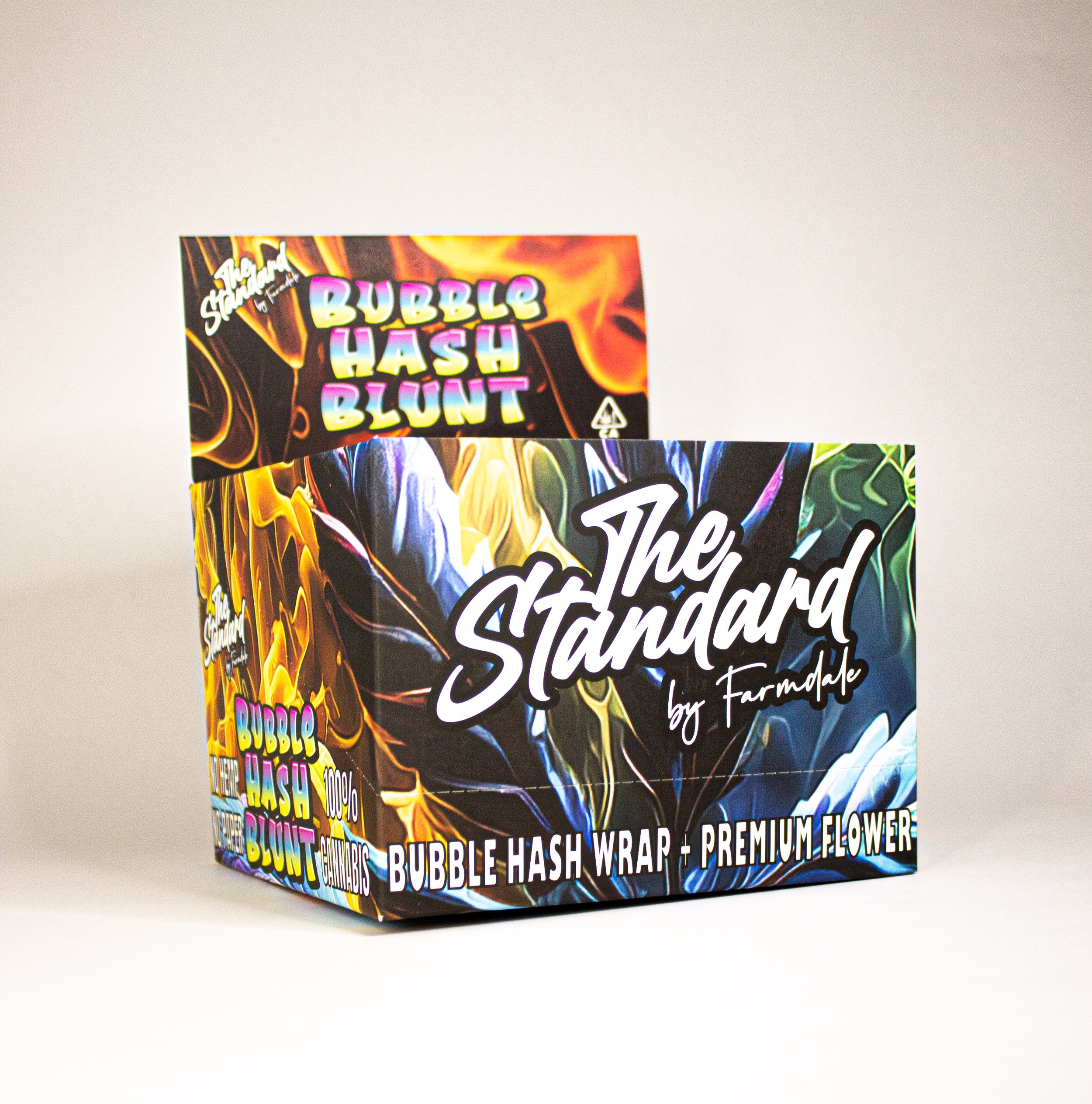 Colorful box labeled 'The Standard by Farmalade' featuring bubble hash blunt wraps and premium flower.