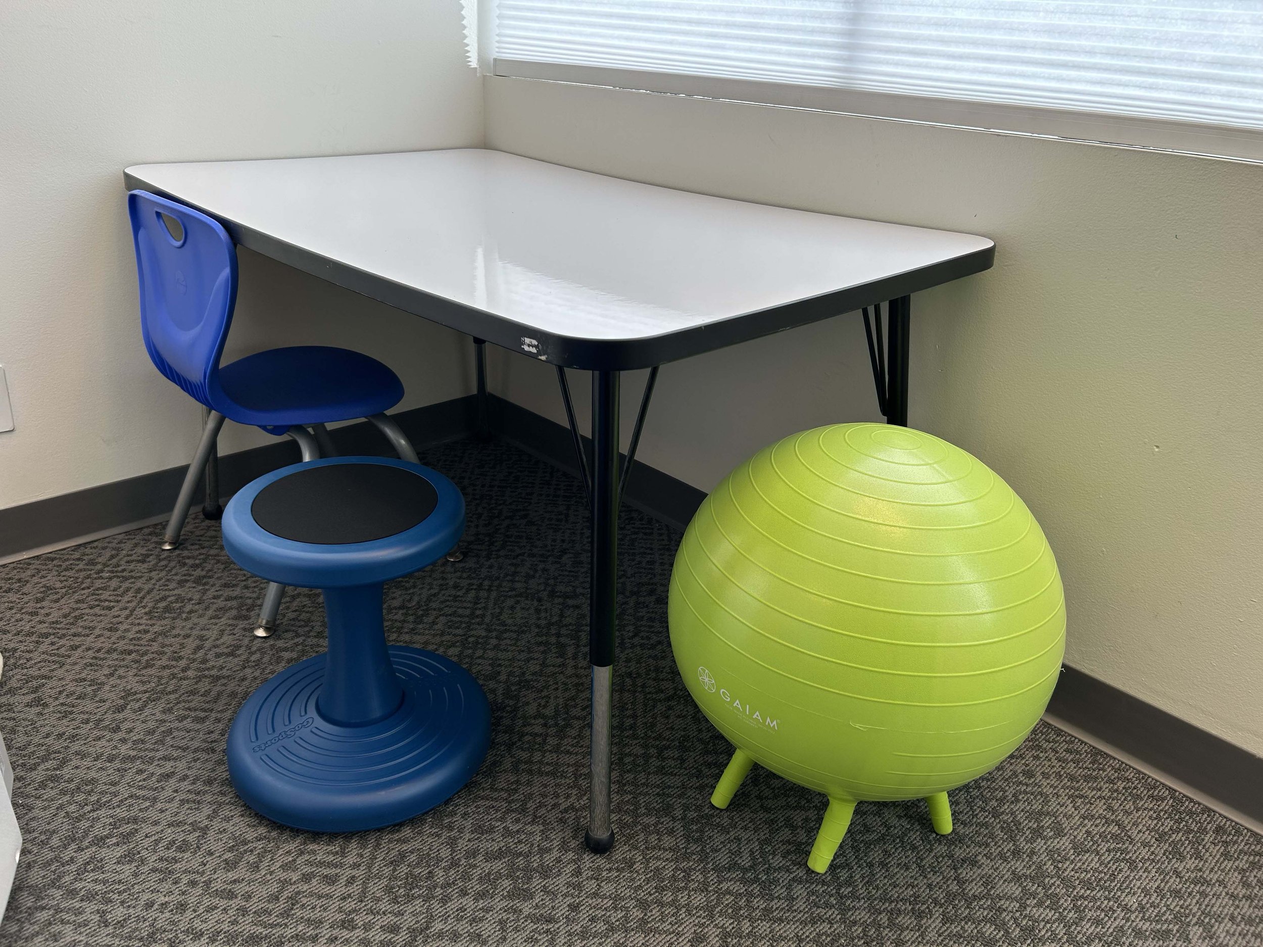 Small whiteboard table for little kiddos, plus flexible seating for little wiggles