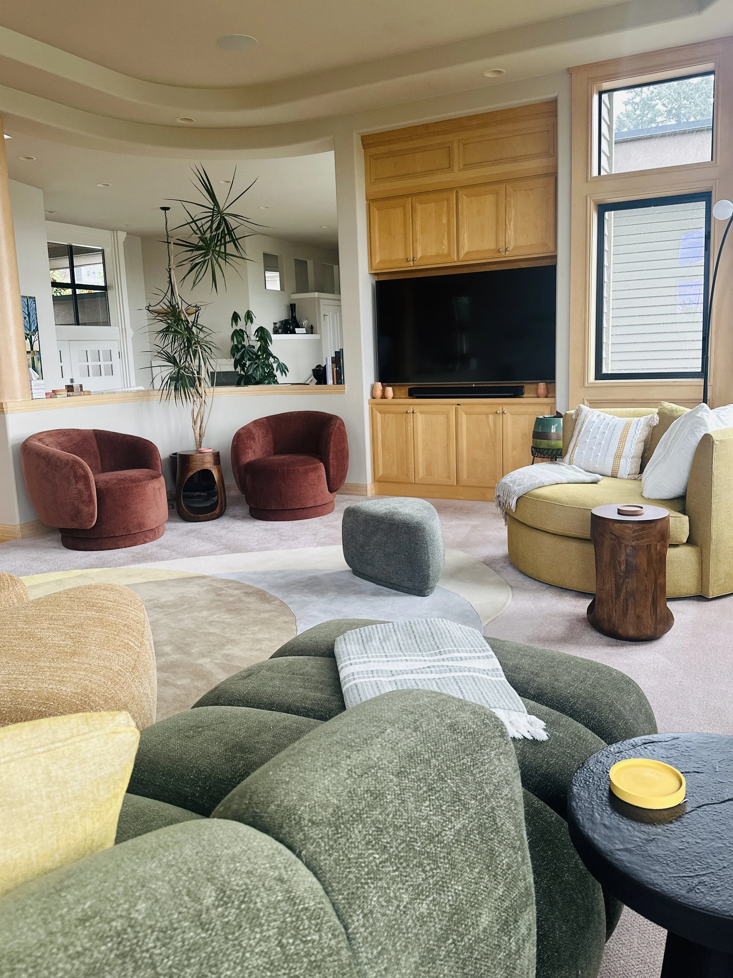 This living room creates zones for watching TV, reading a book and having an intimate conversation with a friend. While they each hold their ground, they seamlessly connect and compliment each other.