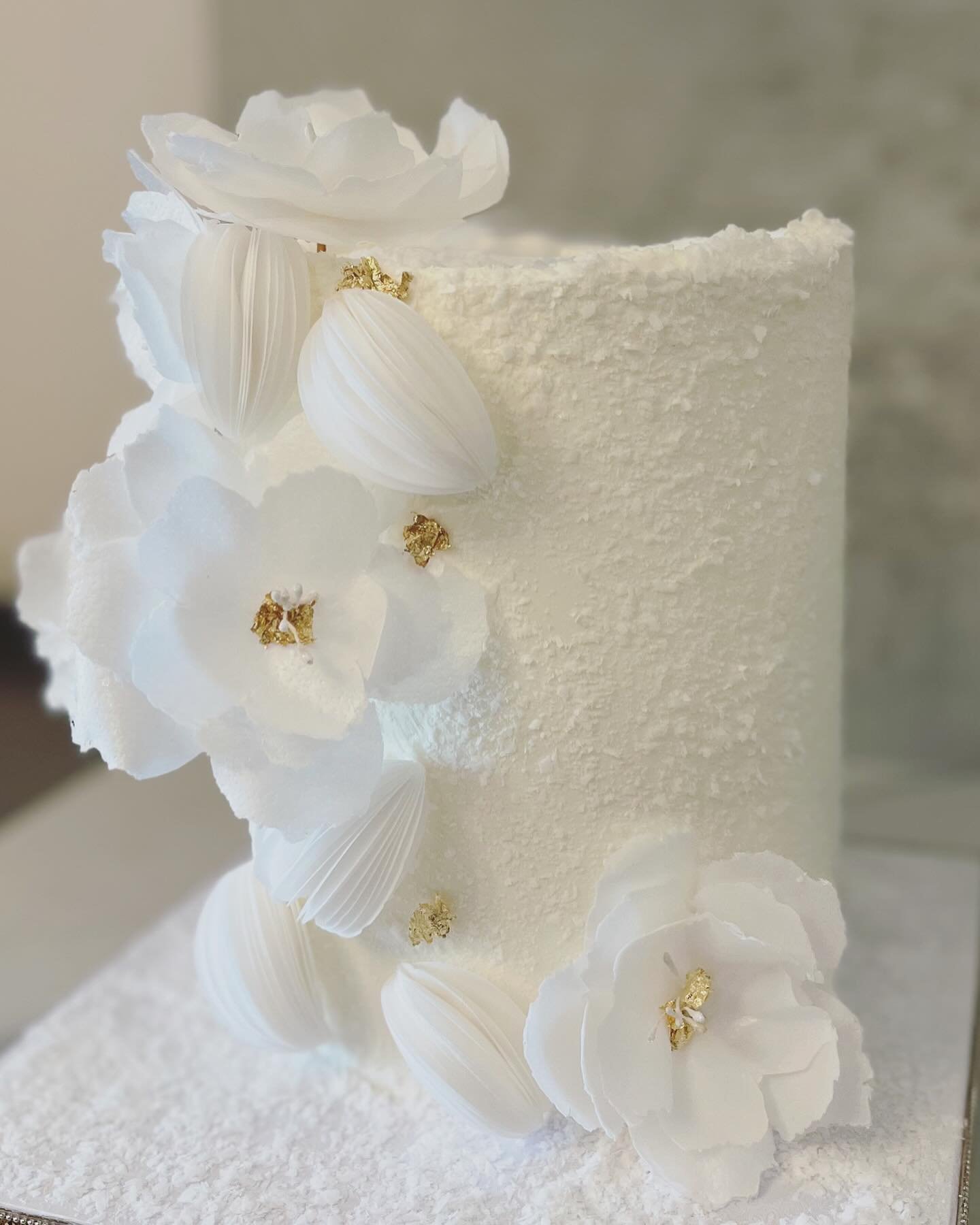 What do you think about this wafer paper inspired cake?

I&rsquo;ve always thought wafer paper flowers were time consuming but to be honest they are not. I had so much fun making this cake. I used my fondant flower cutter to create this. 

So this we