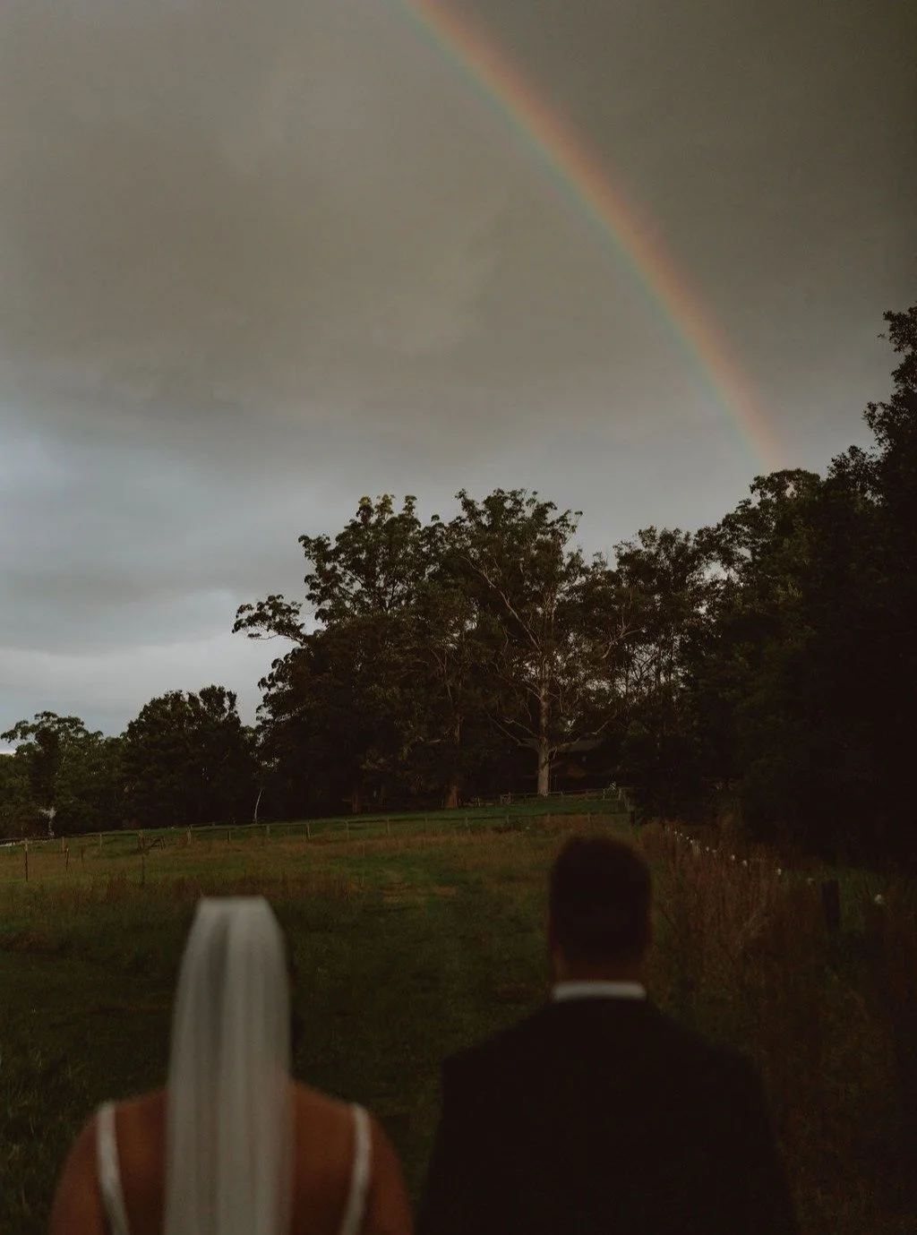 When you book a good photographer&hellip; even the rain shows up for golden hour. 🌈
.
I'll always love these magical shots from @jacobhughescreative at @yarramalongvalleyfarmstay of Hayden and Harlie 💞 
.
.
.
.
.
.#thelovepage #thelovepagecelebrant