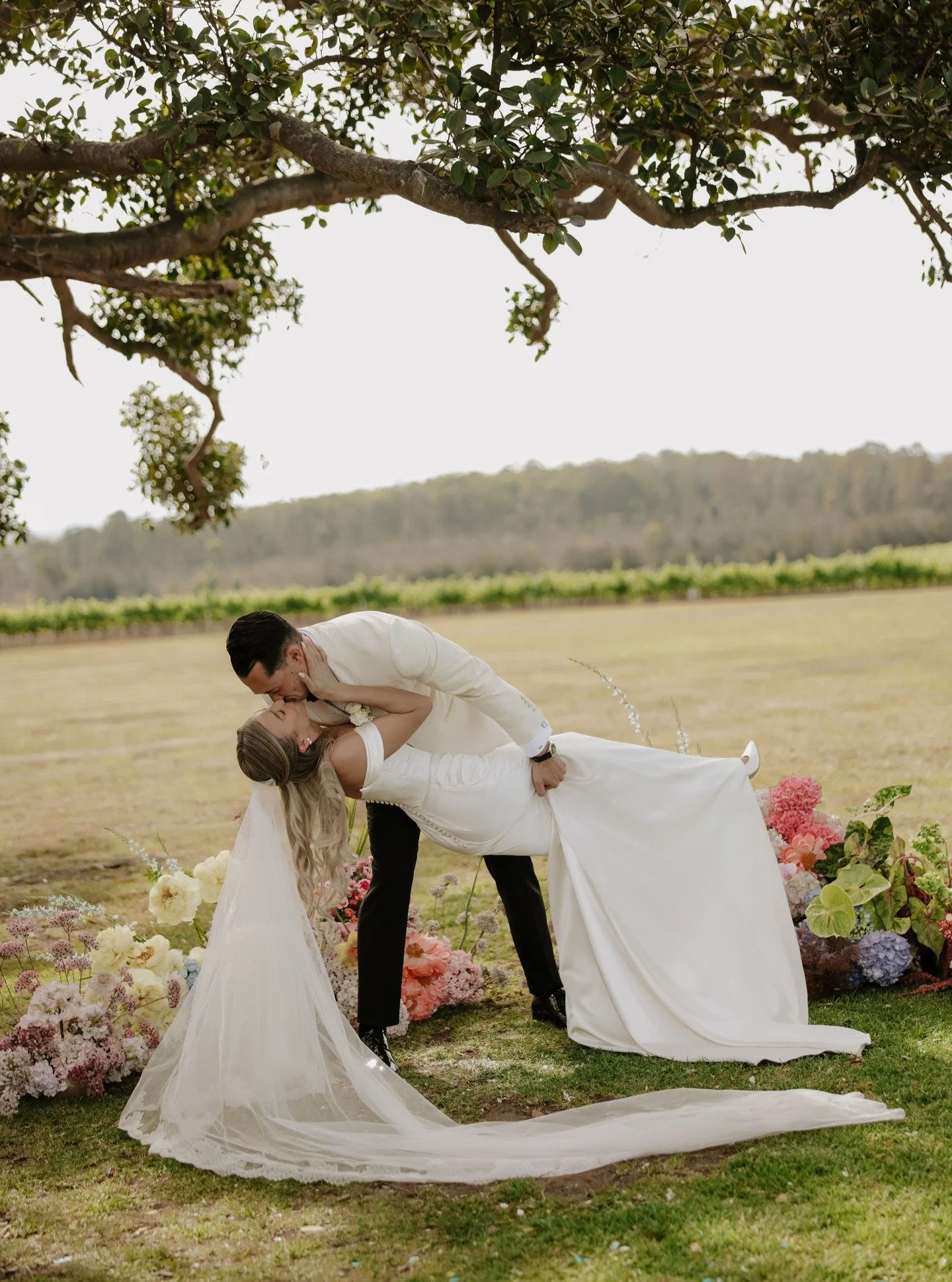 Now THAT'S what we call an SFKP - AKA Solid First Kiss Dip!
Ellie and Andrew, I feel like you practiced that. Effortless perfection, you two are the absolute cutest! I can't help but slap on the biggest smile looking at this gorgeous pair, what a mat