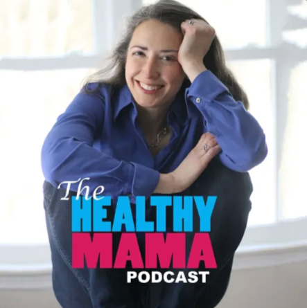 Smiling woman wearing a blue shirt, sitting by a window with sunlight, with text that reads 'The Healthy Mama Podcast'.
