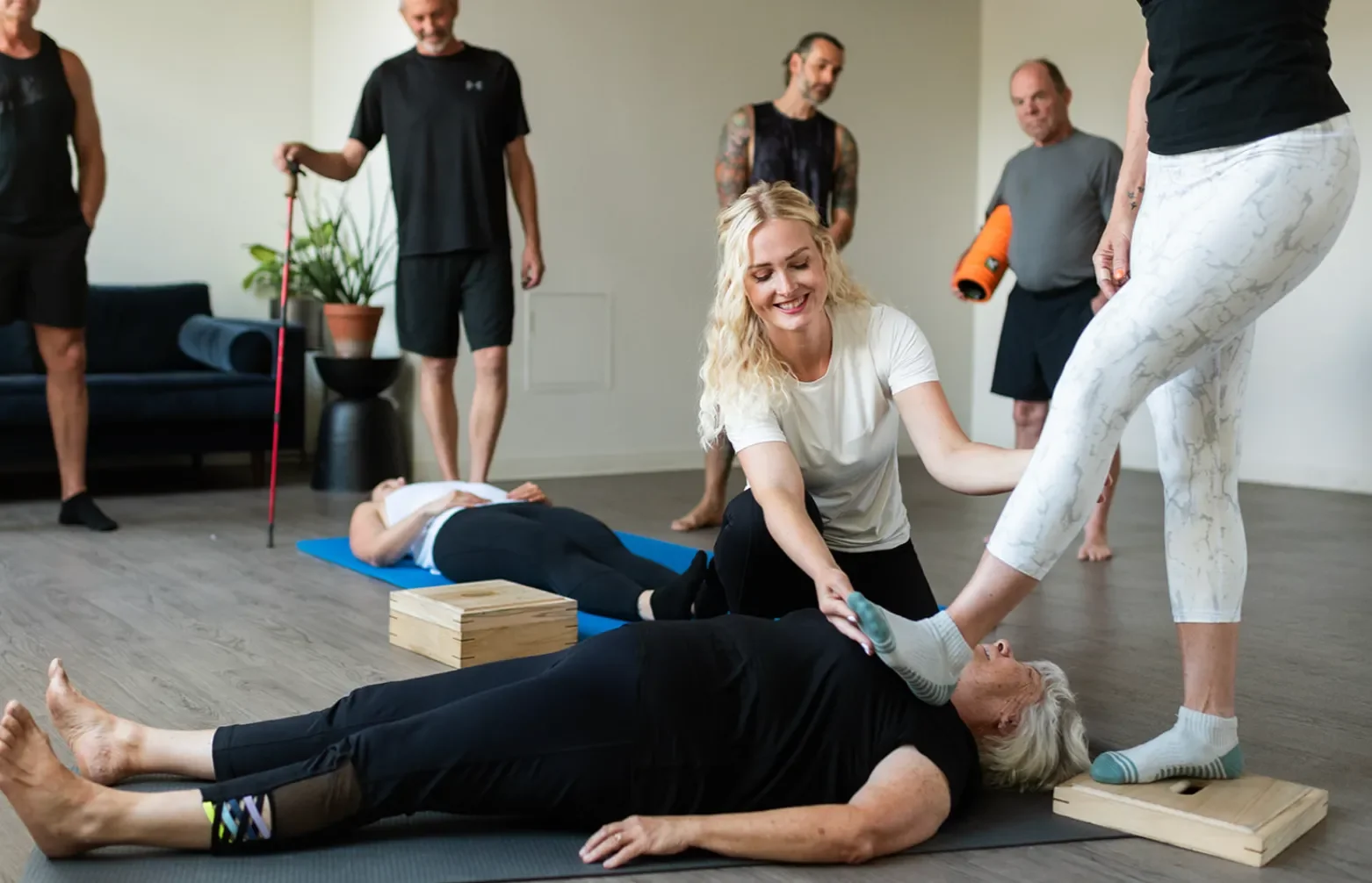 Small group fascia release class with hands-on movement coaching and mobility work.