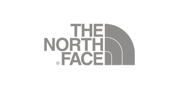 Black and white logo for The North Face with stylized text and half-dome graphic.