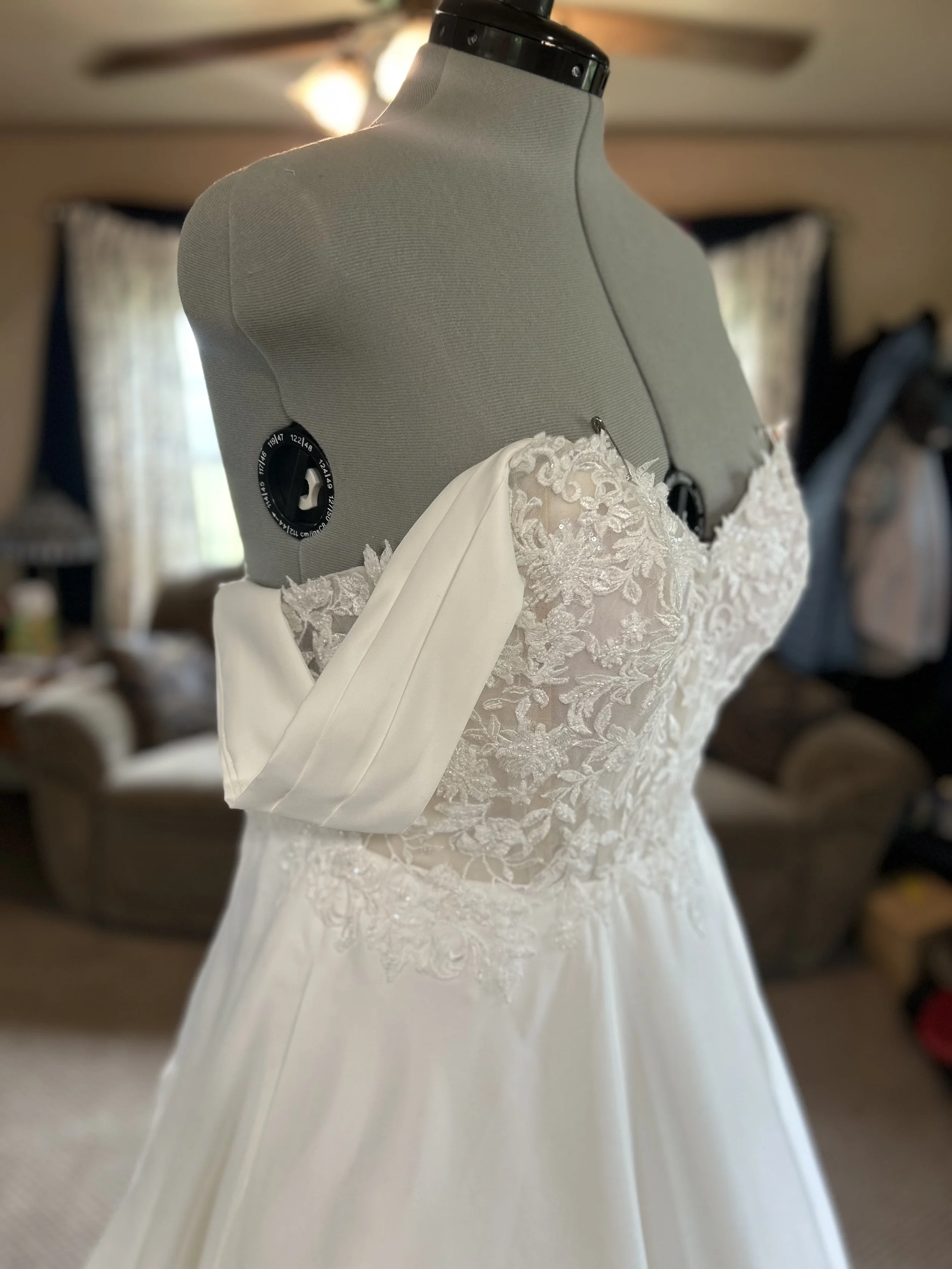 Custom made silk swag sleeve for strapless wedding dress with beaded bodice and chiffon A-line skirt