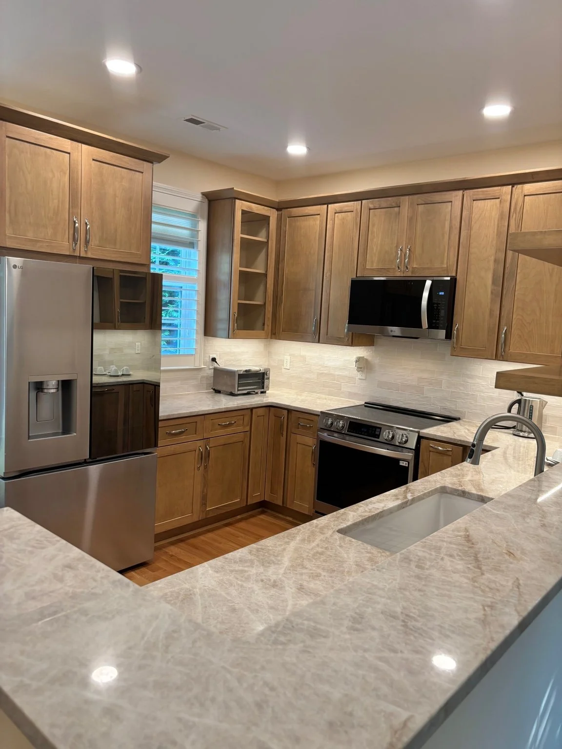 Transitional Kitchen With Warm Wood Cabinetry Kitchen Remodel by Atlas Quartz & Granite project photo