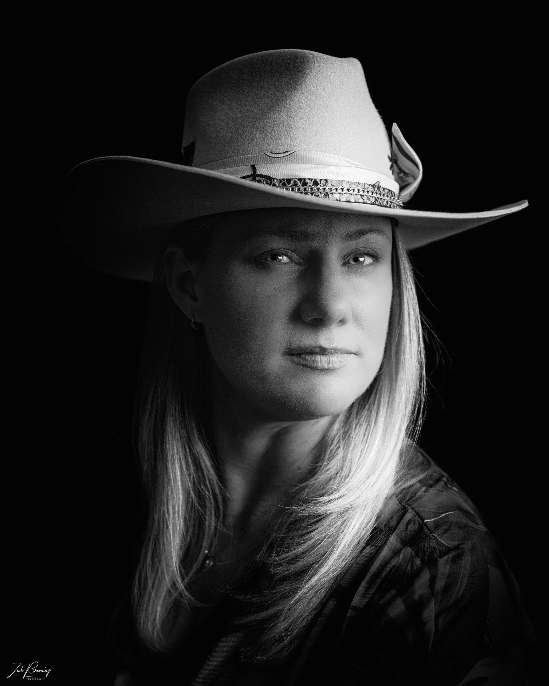 Black-and-white portrait of Penny wearing a hat, photographed by Zech Browning.