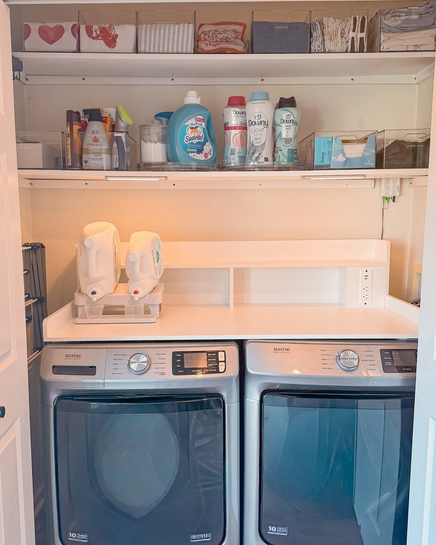 Small laundry closet, BIG functionality! 🧺✨

Even tiny spaces can work wonders with the right setup! We added a counter on top of the washer and dryer for instant folding space, hooks for air-drying delicates, turntables for easy-access laundry soap