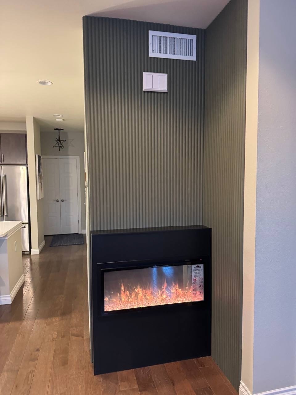 Corner Fireplace Accent Wall with Vertical Slat Panels – Orlando, FL