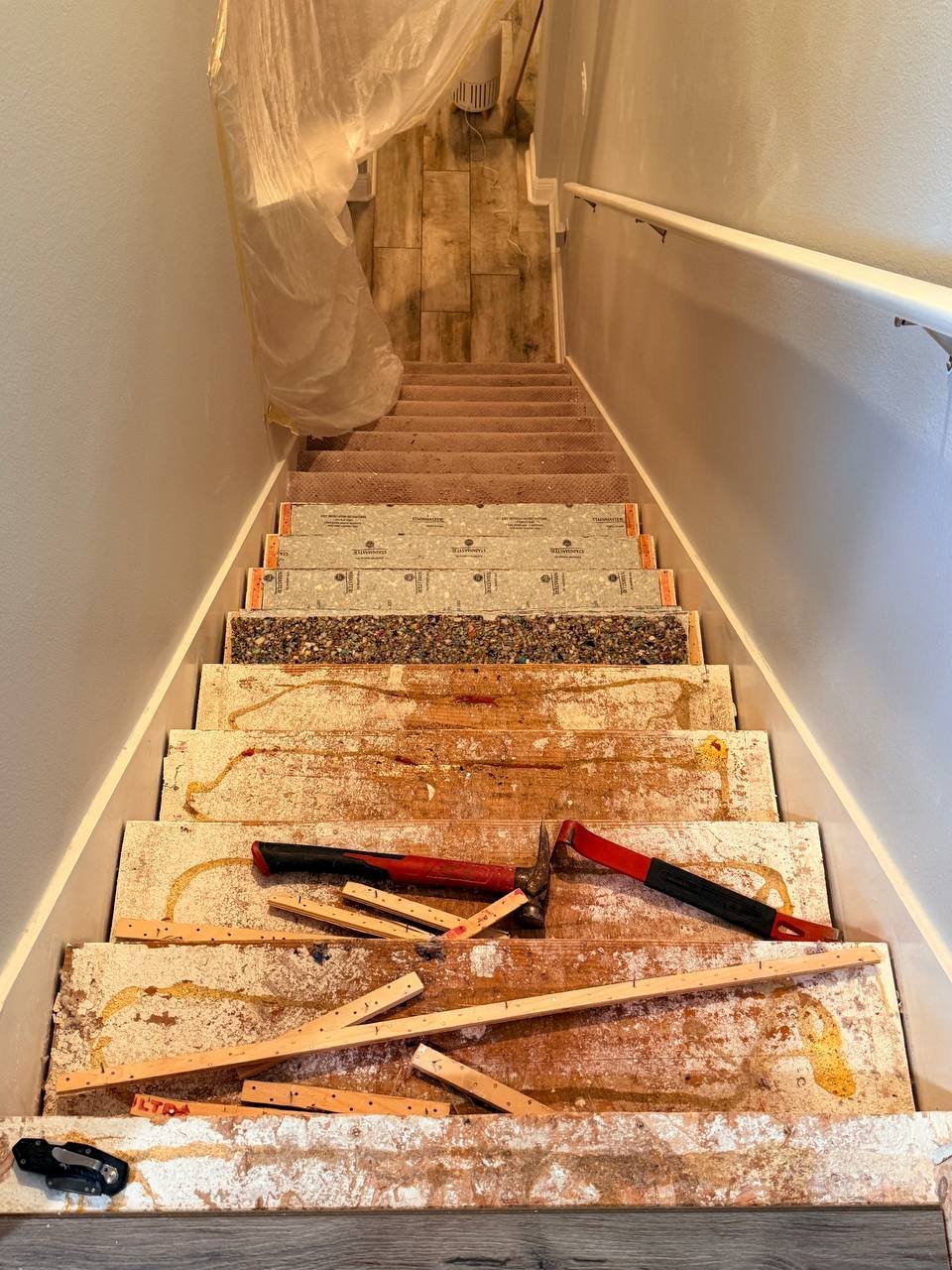staircase during carpet removal process Florida