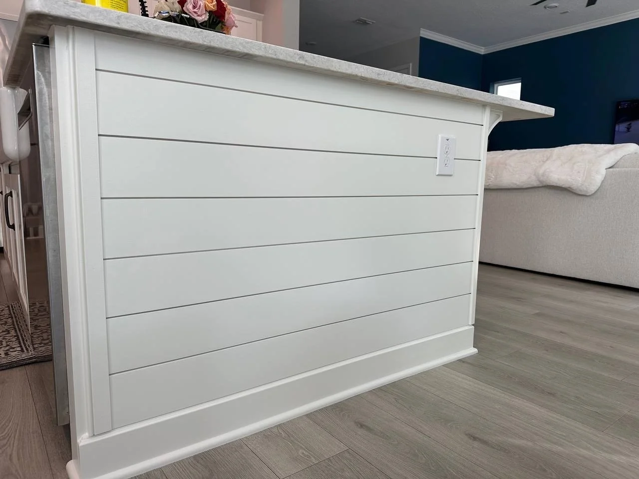 Finish carpentry kitchen island detail with trim base and horizontal paneling in Lakewood Ranch Florida