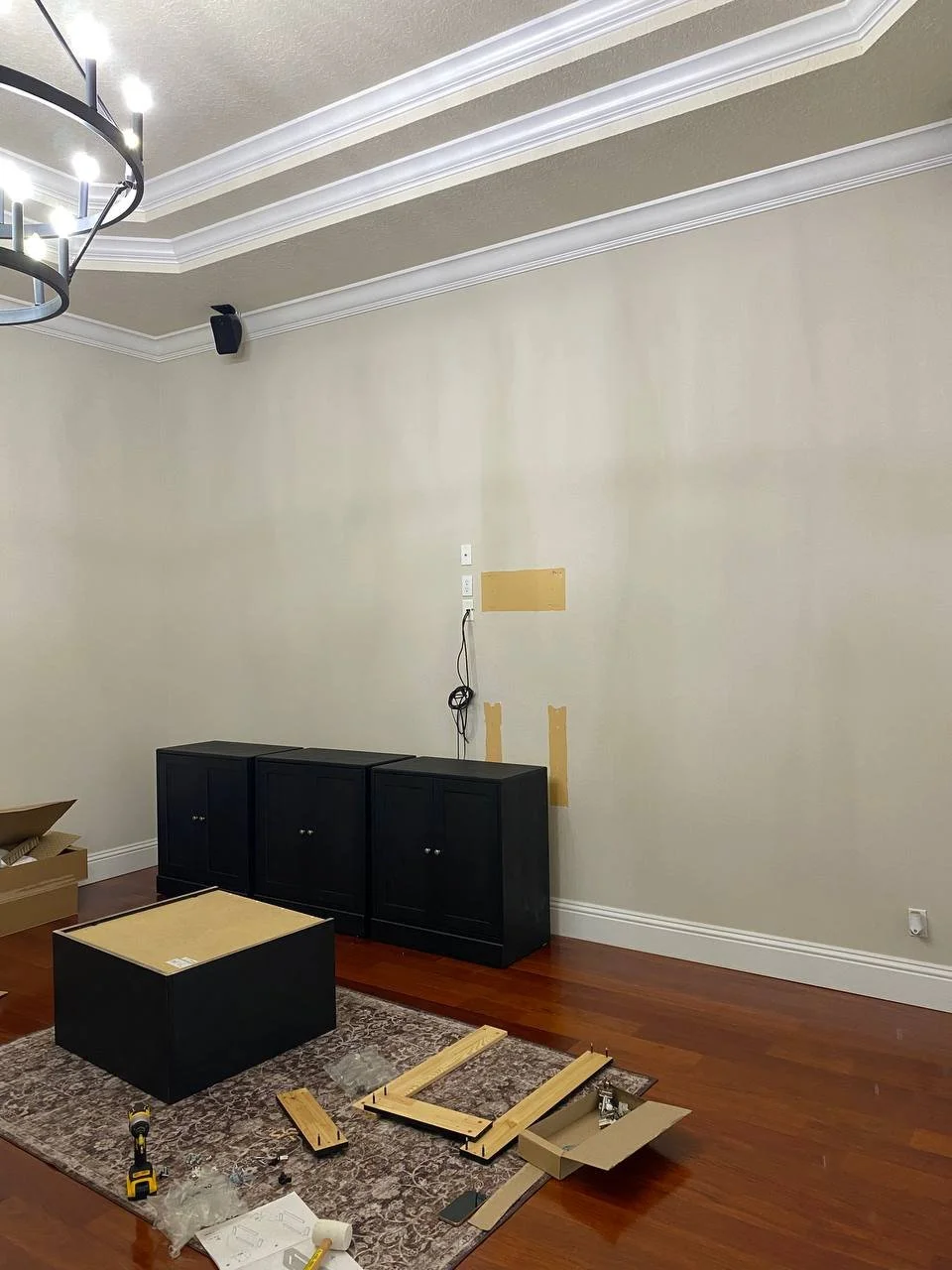 Media wall cabinet assembly process during installation in Cape Coral Florida