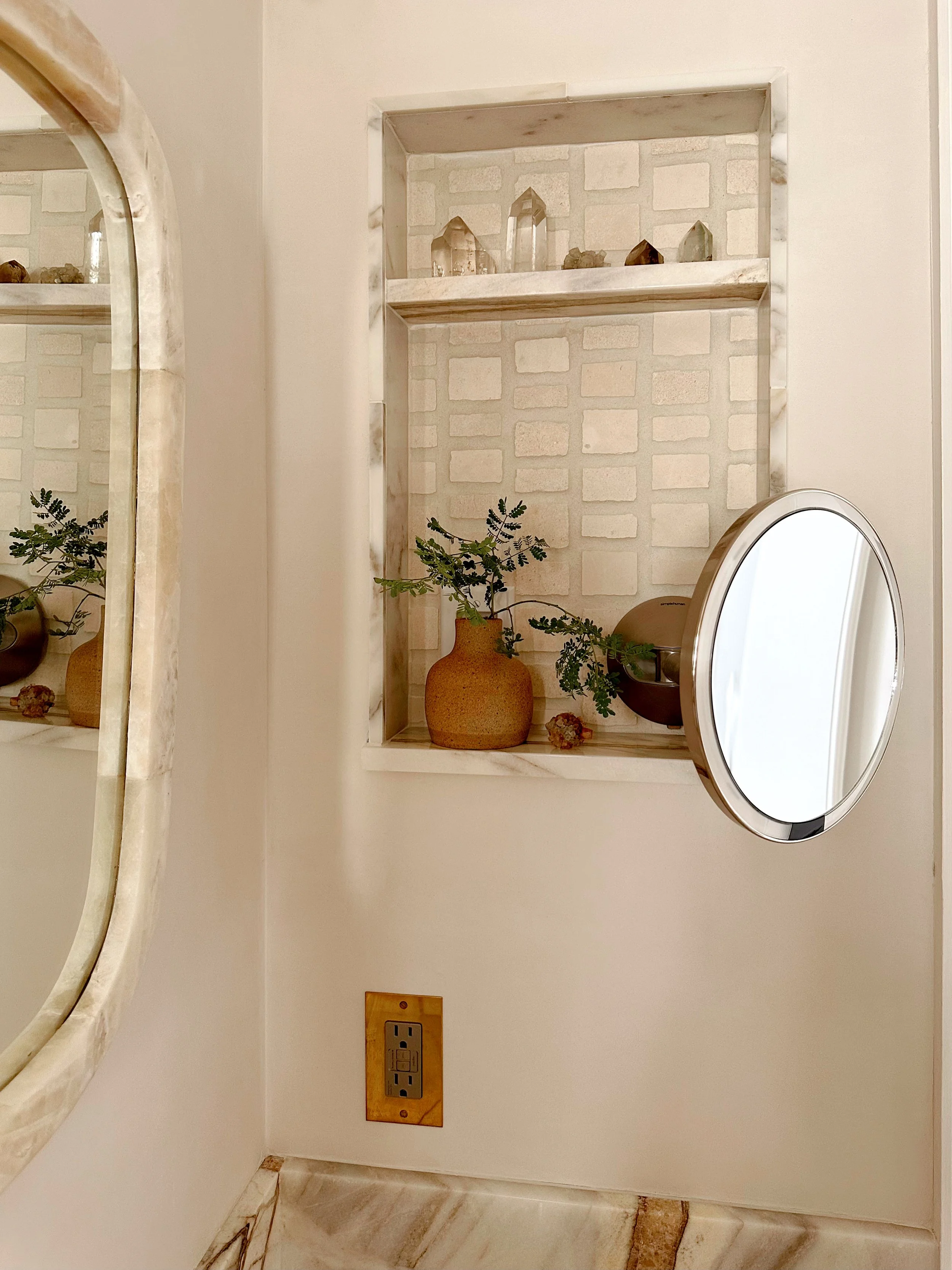 niche with electrical for charging and lighted magnifying mirror