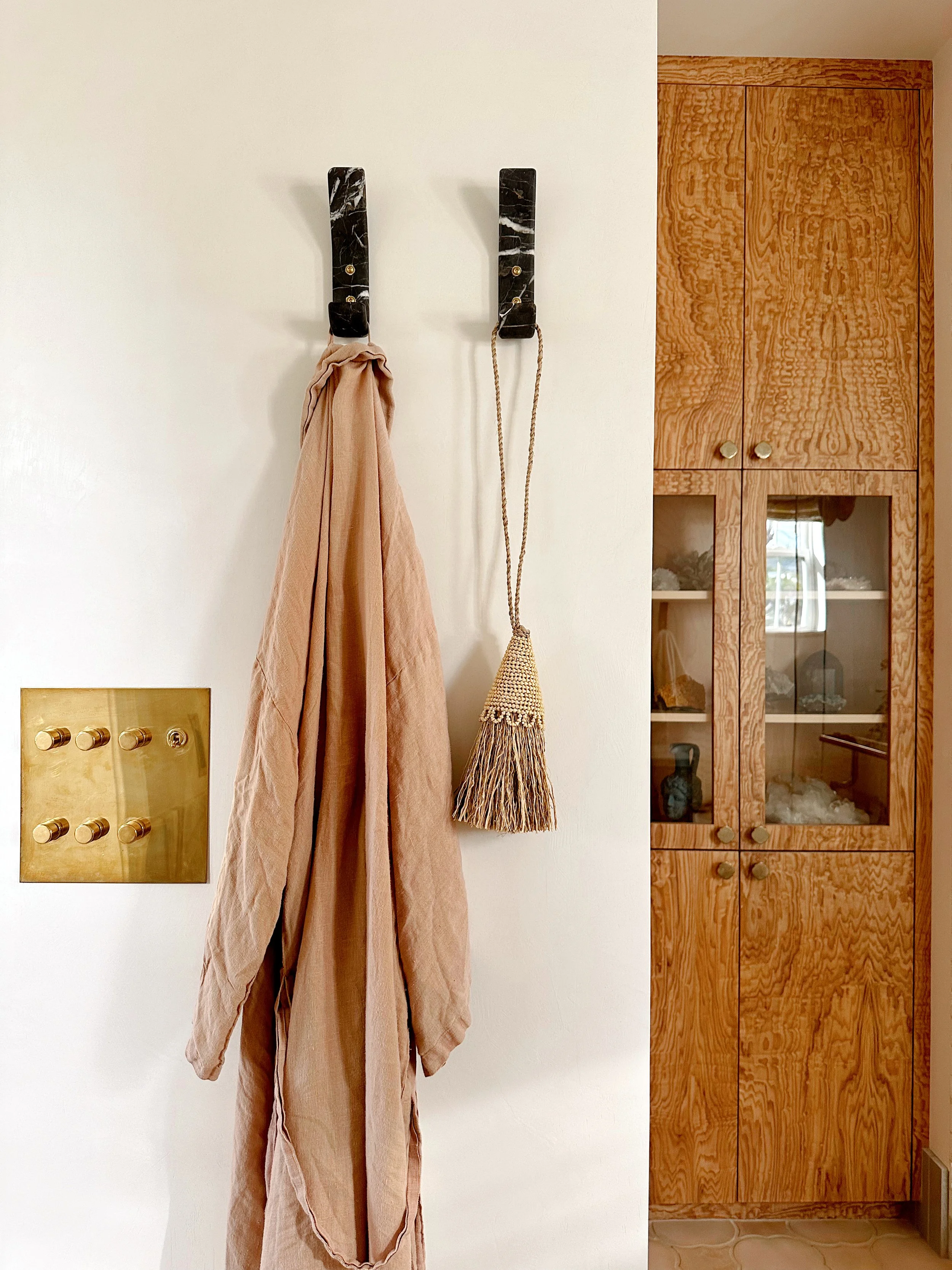 plaster walls, raw brass lighting plate for customizable lighting experience